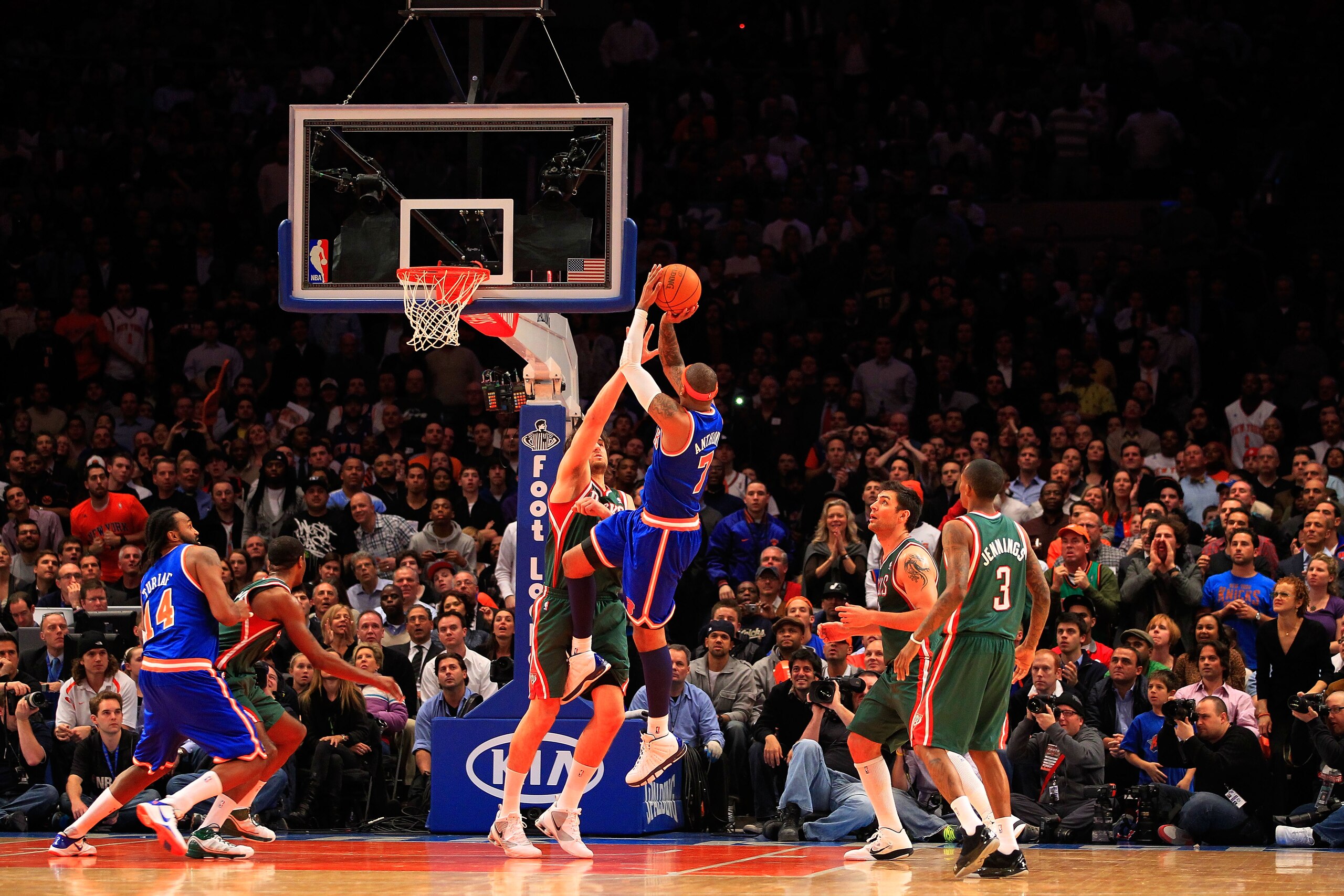 NEW YORK, NY - FEBRUARY 23:  Carmelo Anthony #7 of the New York Knicks shoots the ball over Andrew Bogut #6 of the Milwaukee Bucks at Madison Square Garden on February 23, 2011 in New York City. NOTE TO USER: User expressly acknowledges and agrees that, b