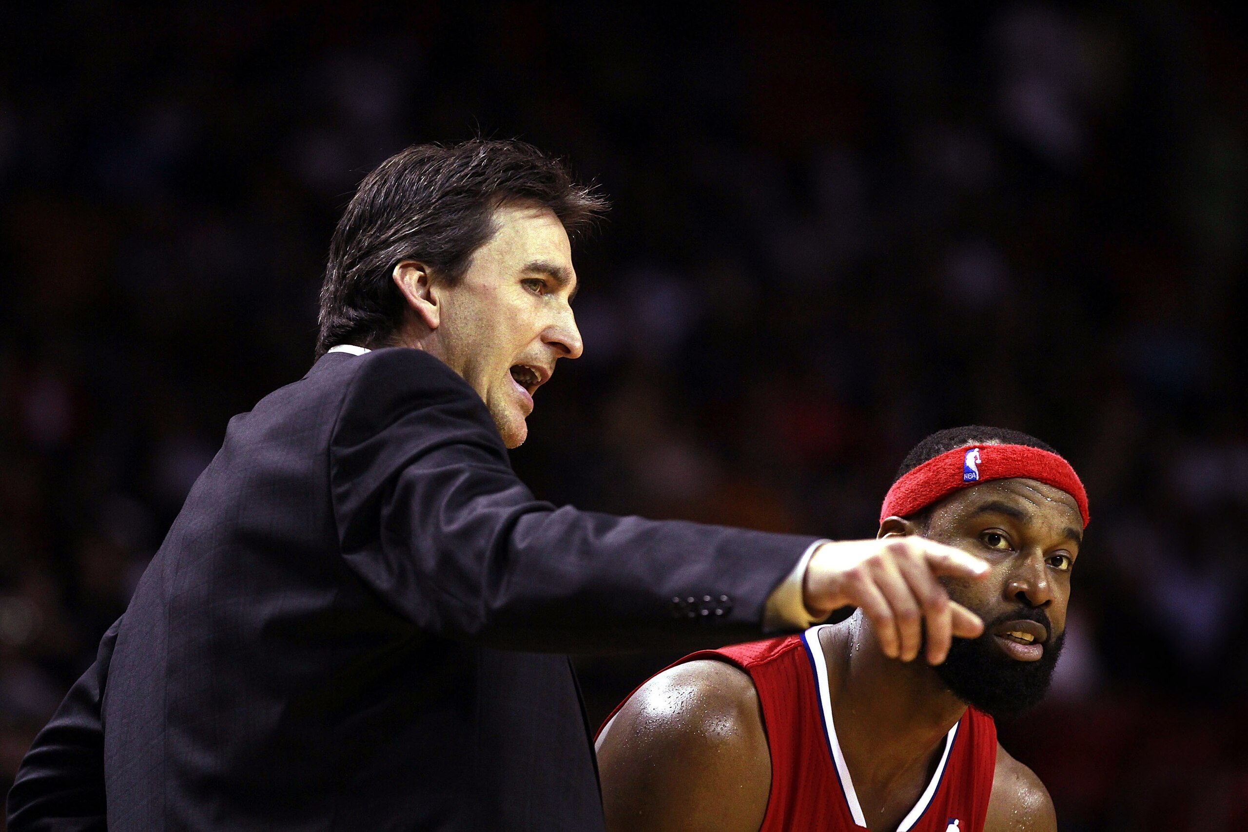 MIAMI - FEBRUARY 06: Coach Vinnie del Negro and Guard Baron Davis #5 of the L.A. Clippers speak against the Miami Heat at American Airlines Arena on February 6, 2011 in Miami, Florida. The Heat defeated the Clippers 97-79. NOTE TO USER: User expressly ack
