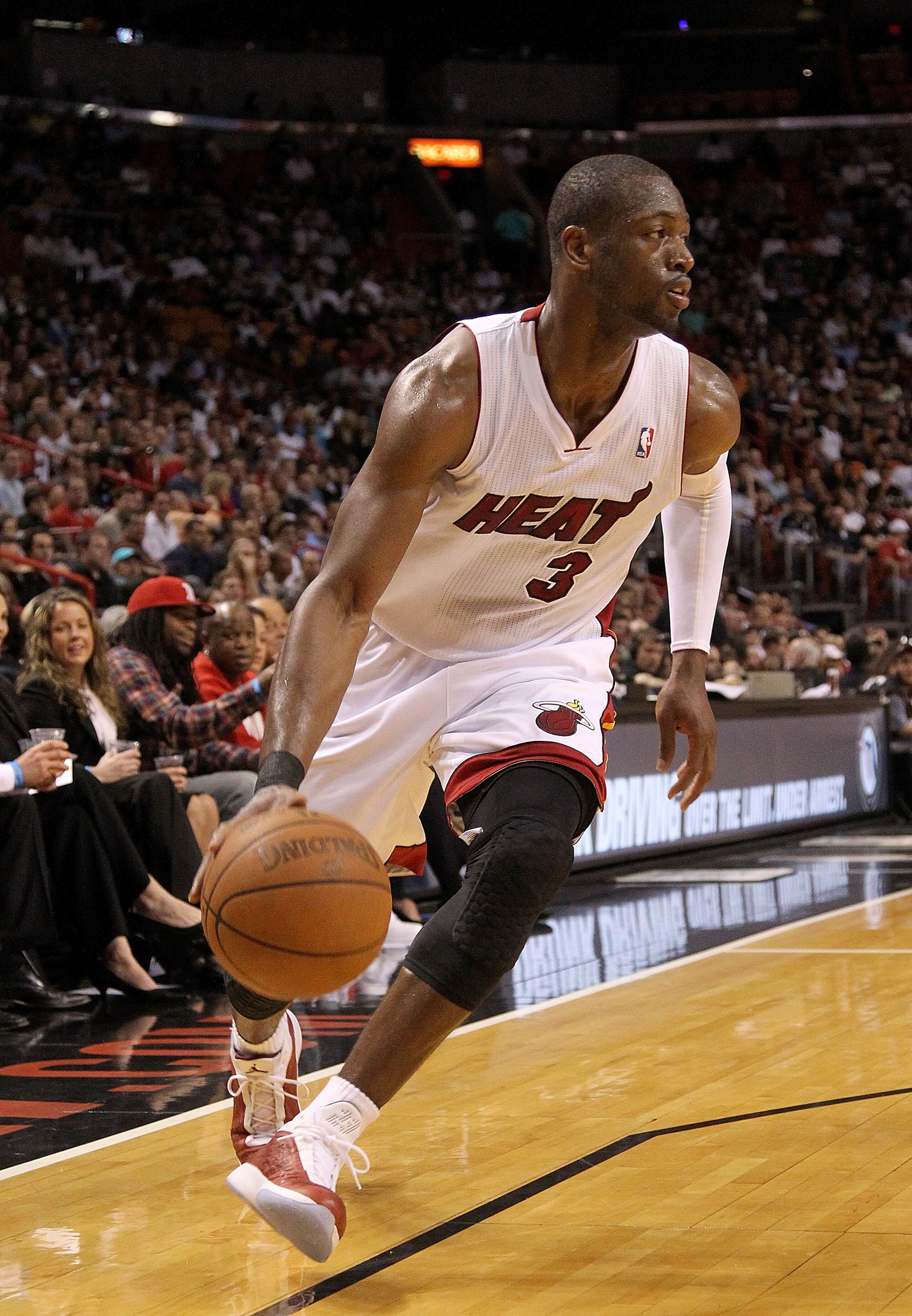 MIAMI, FL - FEBRUARY 22:  Dwyane Wade #3 of the Miami Heat dribbles around the corner during a game against the Sacramento Kings at American Airlines Arena on February 22, 2011 in Miami, Florida. NOTE TO USER: User expressly acknowledges and agrees that,