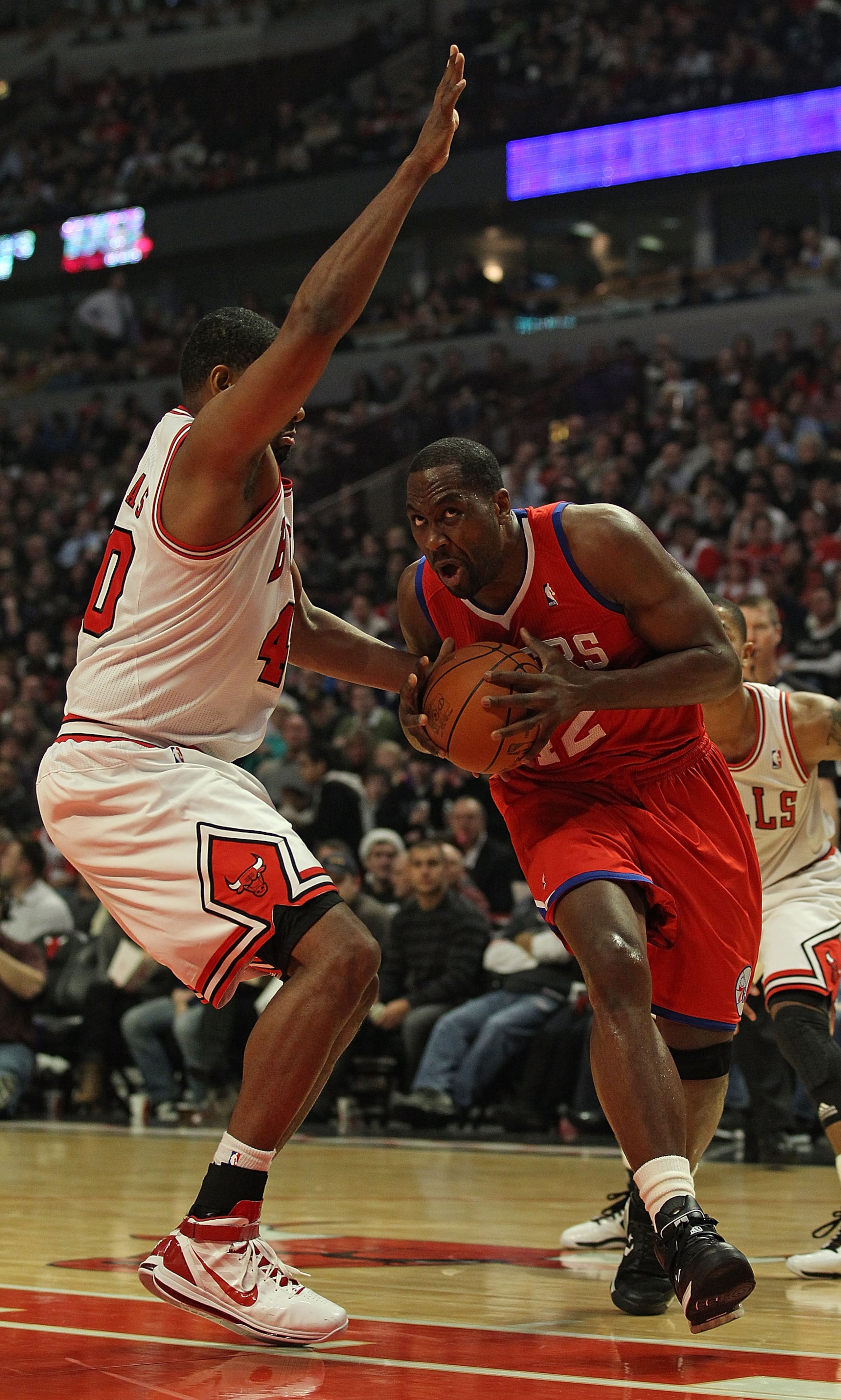 CHICAGO, IL - DECEMBER 21: Elton Brand #42 of the Philadelphia 76ers moves against Kurt Thomas #40 of the Chicago Bulls at the United Center on December 21, 2010 in Chicago, Illinois. The Bulls defeated the 76ers 121-76. NOTE TO USER: User expressly ackno