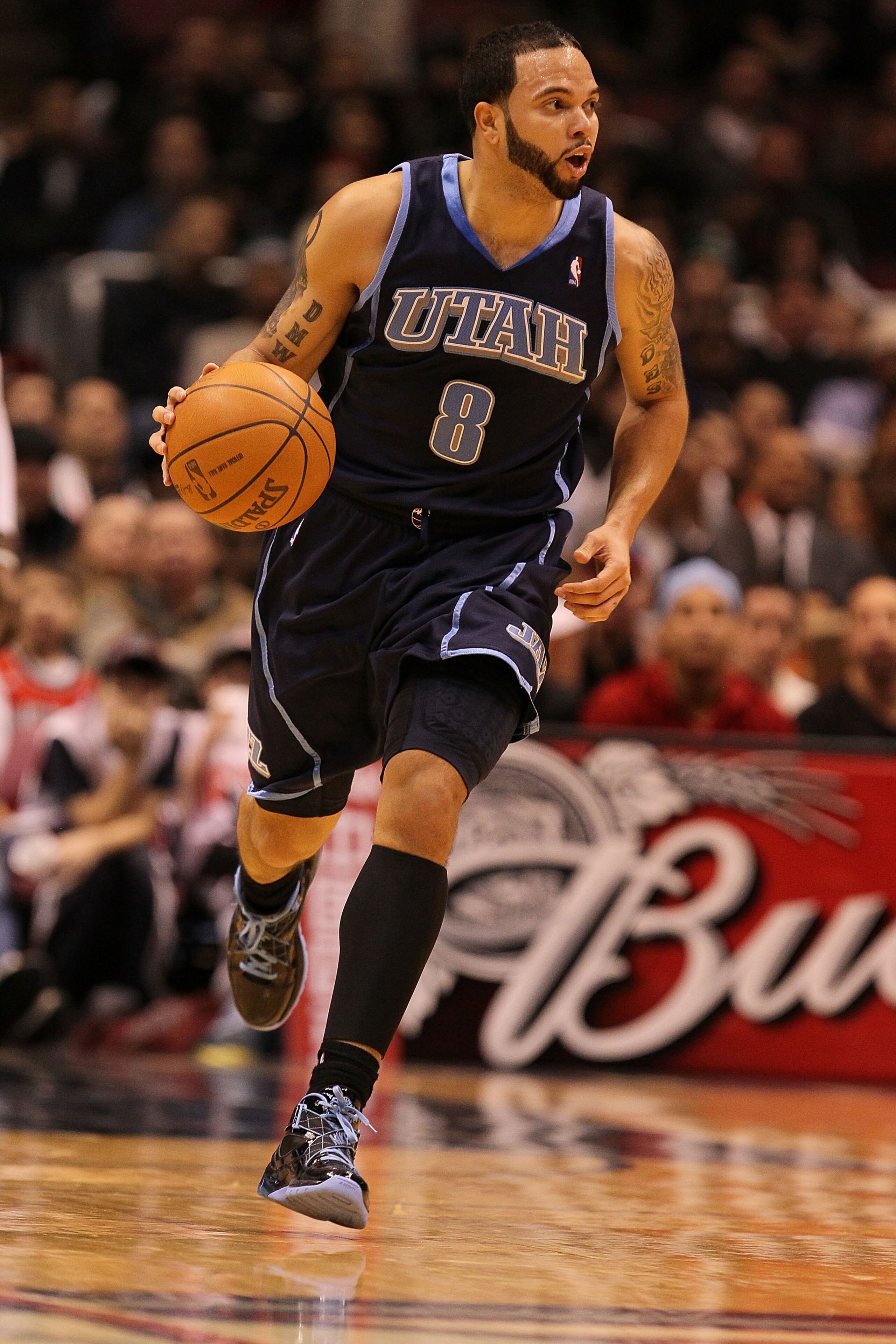 EAST RUTHERFORD, NJ - DECEMBER 16:  Deron Williams #8 of The Utah Jazz dunks against the New Jersey Nets during their game on December 16th, 2009 at The Izod Center in East Rutherford, New Jersey.  NOTE TO USER: User expressly acknowledges and agrees that
