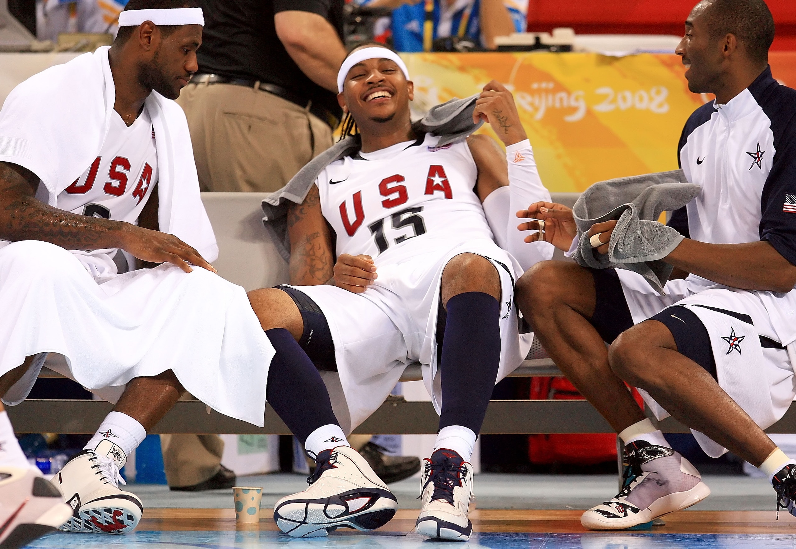 BEIJING - AUGUST 18:  Carmelo Anthony #15 jokes around with Lebron James #6 and Kobe Bryant #10 of the United States on the bench during the men?s basketball preliminaries against Germany at the Wukesong Indoor Stadium on Day 10 of the Beijing 2008 Olympi
