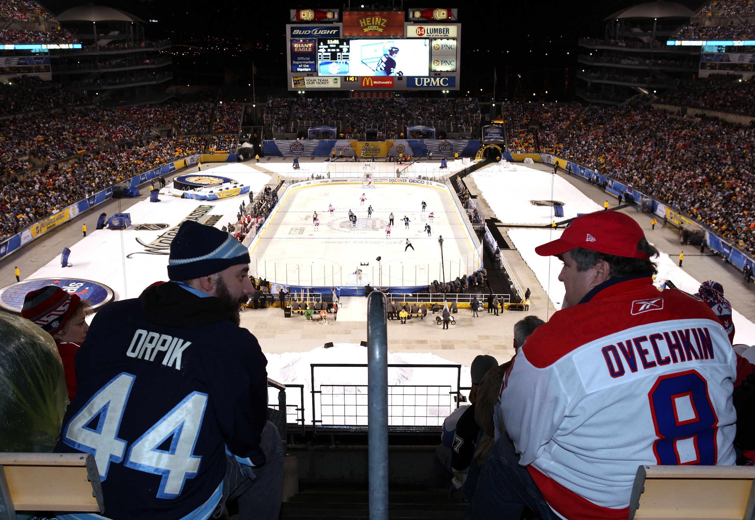 PITTSBURGH, PA - JANUARY 01:  Fans watch as the Pittsburgh Penguins take on the Washington Capitals during the 2011 NHL Bridgestone Winter Classic at Heinz Field on January 1, 2011 in Pittsburgh, Pennsylvania. Washington won 3-1.  (Photo by Jamie Squire/G