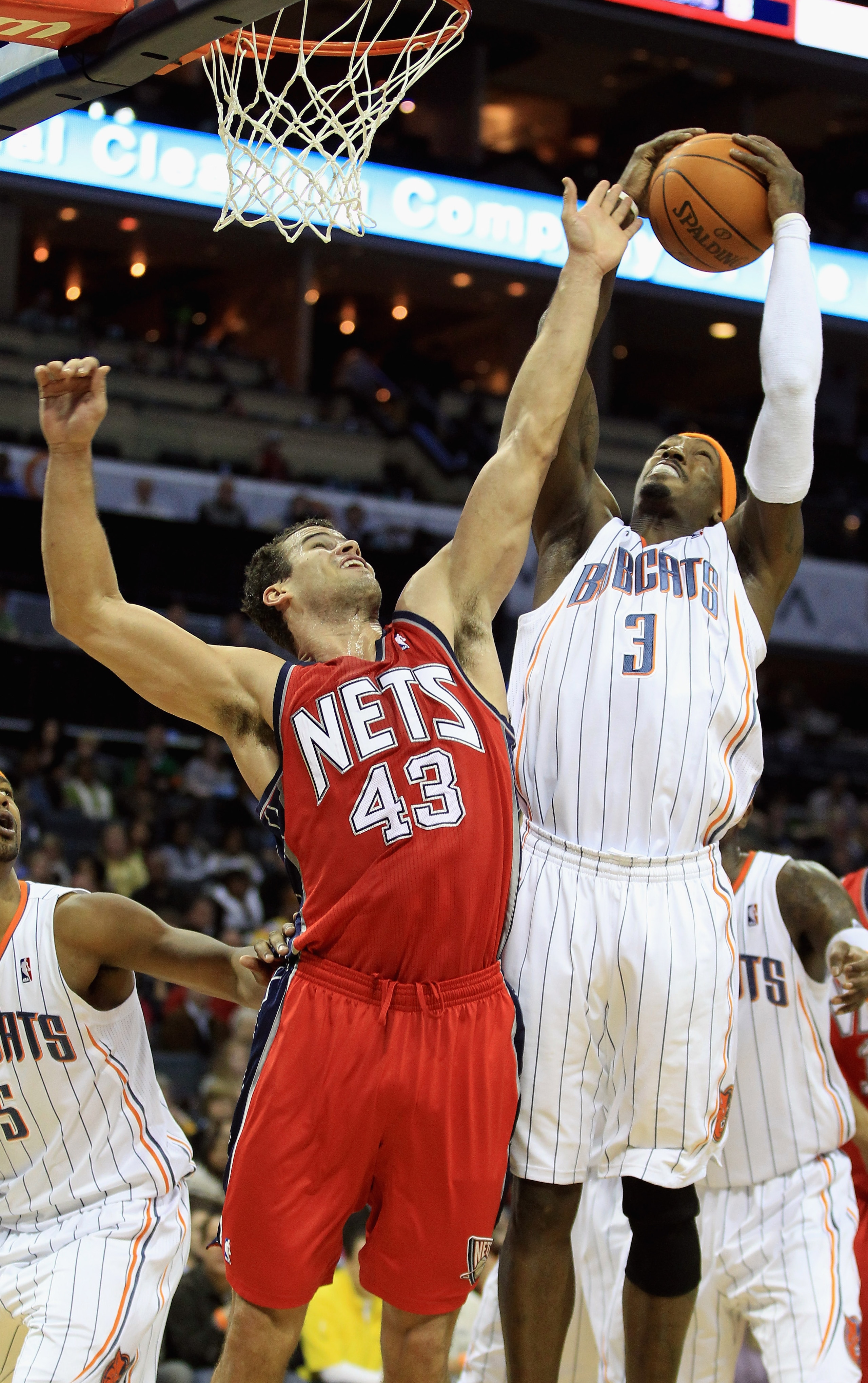 CHARLOTTE, NC - FEBRUARY 11: Kris Humphries #43 of the New Jersey Nets battles for a rebound with Gerald Wallace #3 of the Charlotte Bobcats during their game at Time Warner Cable Arena on February 11, 2011 in Charlotte, North Carolina. NOTE TO USER: Use CHARLOTTE, NC - FEBRUARY 11: Kris Humphries #43 of the New Jersey Nets battles for a rebound with Gerald Wallace #3 of the Charlotte Bobcats during their game at Time Warner Cable Arena on February 11, 2011 in Charlotte, North Carolina. NOTE TO USER: Use
