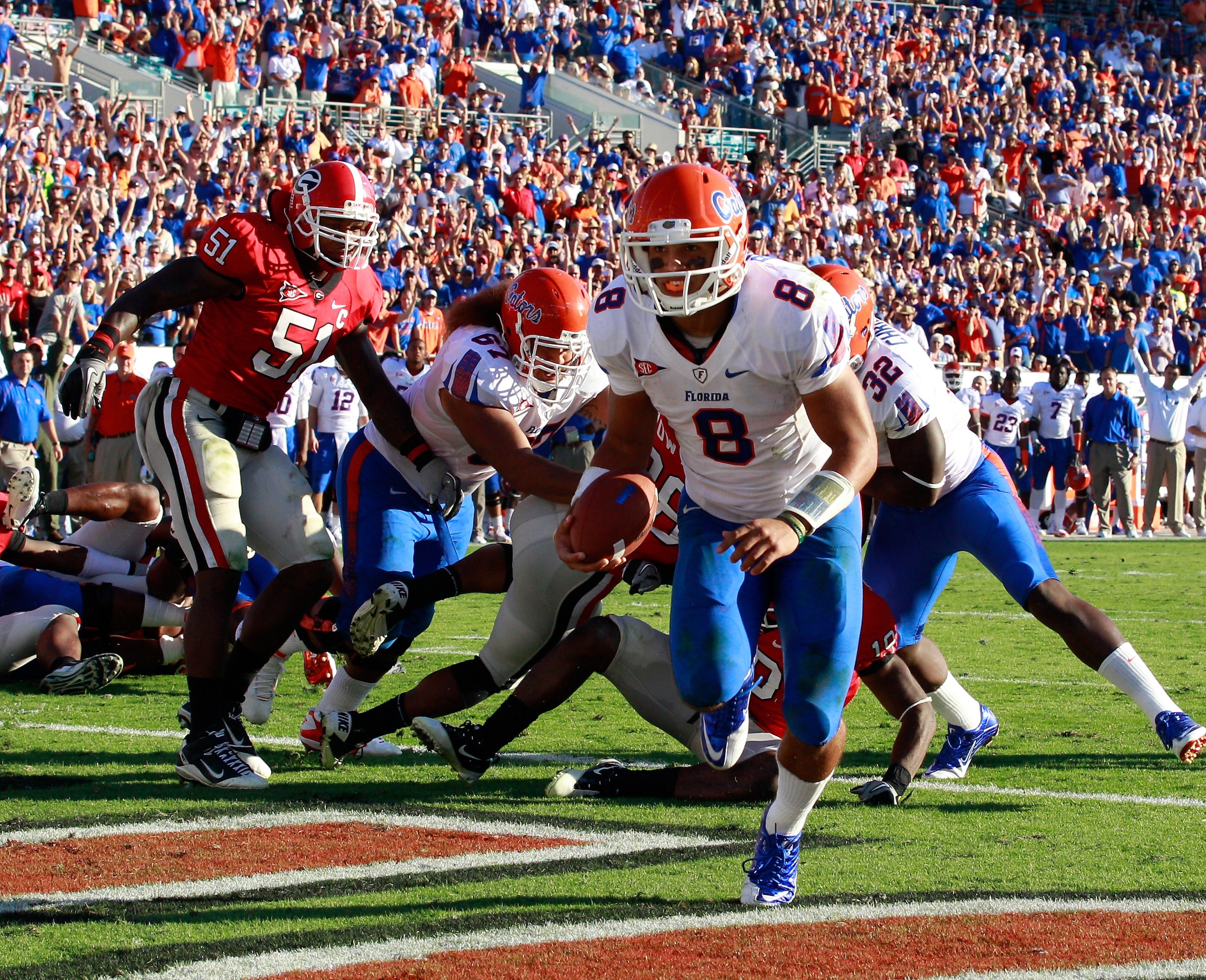 JACKSONVILLE, FL - OCTOBER 30: Quarterback Trey Burton #8 of the Florida Gators runs for a touchdown during the game against the Georgia Bulldogs at EverBank Field on October 30, 2010 in Jacksonville, Florida. (Photo by Sam Greenwood/Getty Images) JACKSONVILLE, FL - OCTOBER 30: Quarterback Trey Burton #8 of the Florida Gators runs for a touchdown during the game against the Georgia Bulldogs at EverBank Field on October 30, 2010 in Jacksonville, Florida. (Photo by Sam Greenwood/Getty Images)