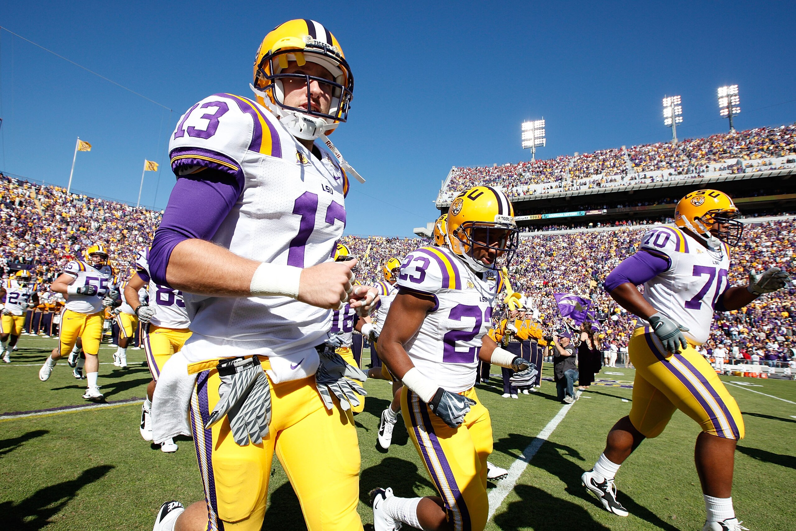 BATON ROUGE, LA - NOVEMBER 06: Members of the Louisiana State University Tigers run onto the field during pregame before playing the Alabama Crimson Tide at Tiger Stadium on November 6, 2010 in Baton Rouge, Louisiana. (Photo by Chris Graythen/Getty Ima BATON ROUGE, LA - NOVEMBER 06: Members of the Louisiana State University Tigers run onto the field during pregame before playing the Alabama Crimson Tide at Tiger Stadium on November 6, 2010 in Baton Rouge, Louisiana. (Photo by Chris Graythen/Getty Ima