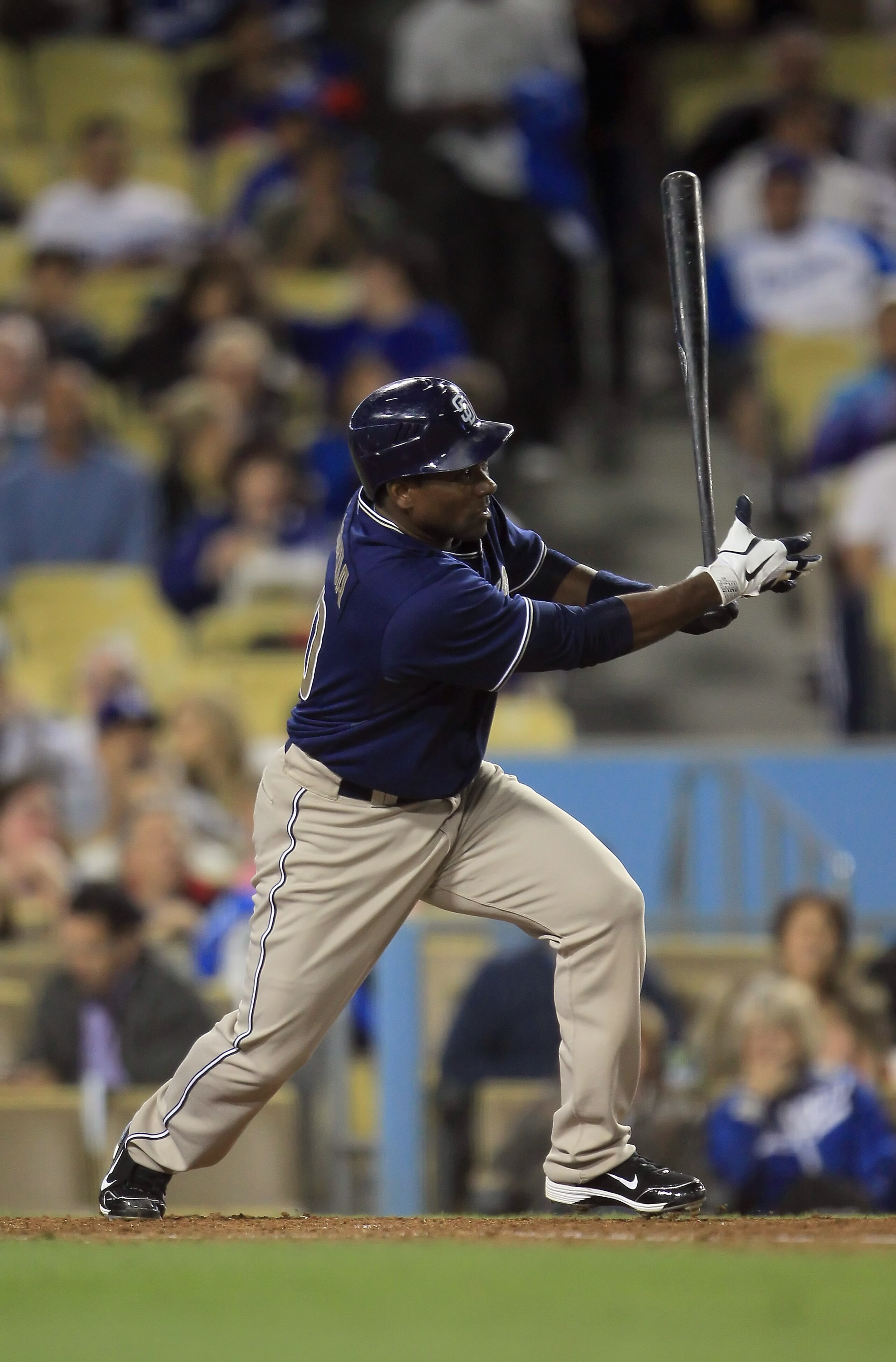 LOS ANGELES, CA - SEPTEMBER 22: Miguel Tejada #10 of the San Diego Padres hits an infield single in the fifth inning against the Los Angeles Dodgers at Dodger Stadium on September 22, 2010 in Los Angeles, California. (Photo by Jeff Gross/Getty Images) LOS ANGELES, CA - SEPTEMBER 22: Miguel Tejada #10 of the San Diego Padres hits an infield single in the fifth inning against the Los Angeles Dodgers at Dodger Stadium on September 22, 2010 in Los Angeles, California. (Photo by Jeff Gross/Getty Images)