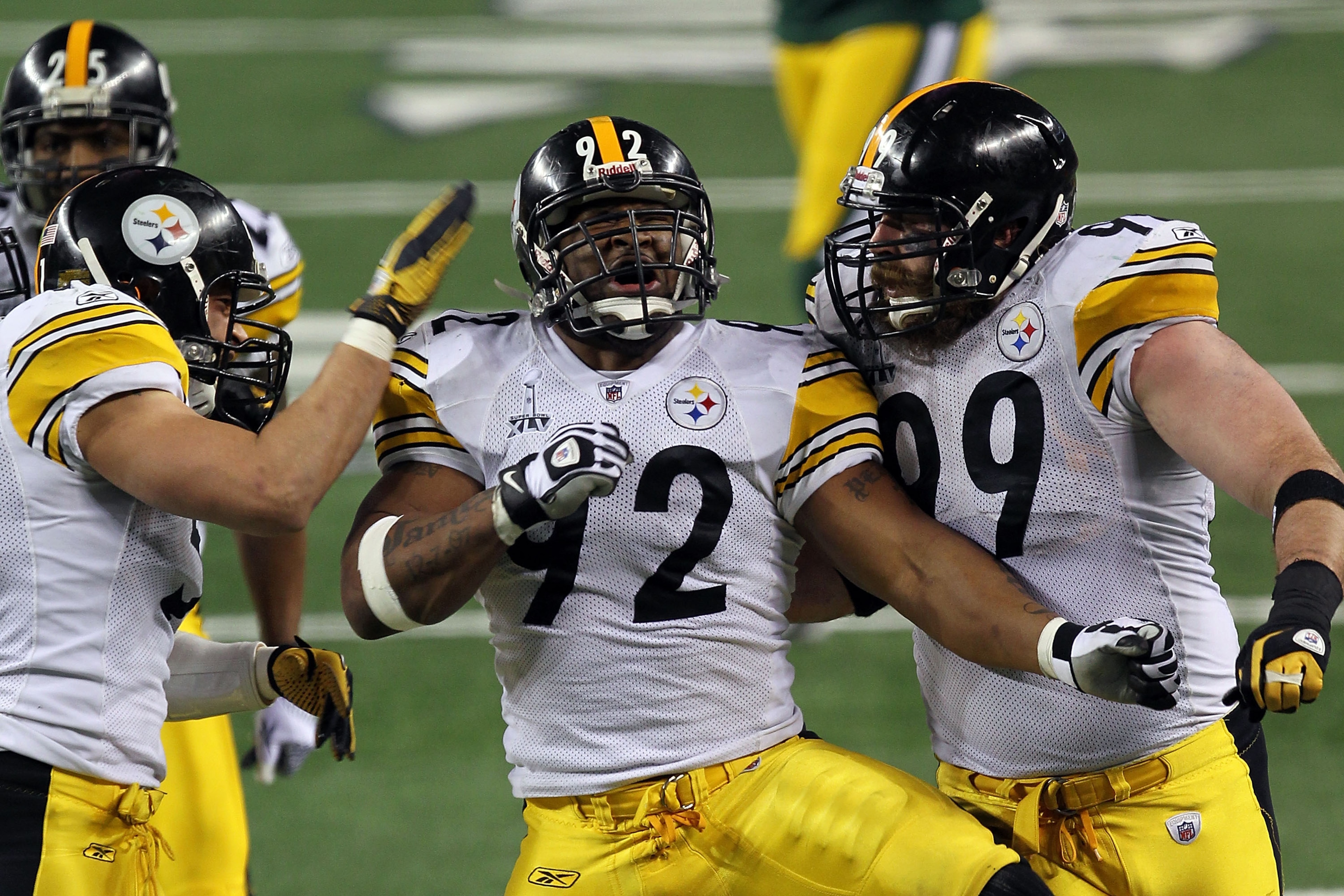 ARLINGTON, TX - FEBRUARY 06: James Farrior #51, James Harrison #92 and Brett Keisel #99 of the Pittsburgh Steelers celebrate a defensive play against the Green Bay Packers during Super Bowl XLV at Cowboys Stadium on February 6, 2011 in Arlington, Texas. ARLINGTON, TX - FEBRUARY 06: James Farrior #51, James Harrison #92 and Brett Keisel #99 of the Pittsburgh Steelers celebrate a defensive play against the Green Bay Packers during Super Bowl XLV at Cowboys Stadium on February 6, 2011 in Arlington, Texas.