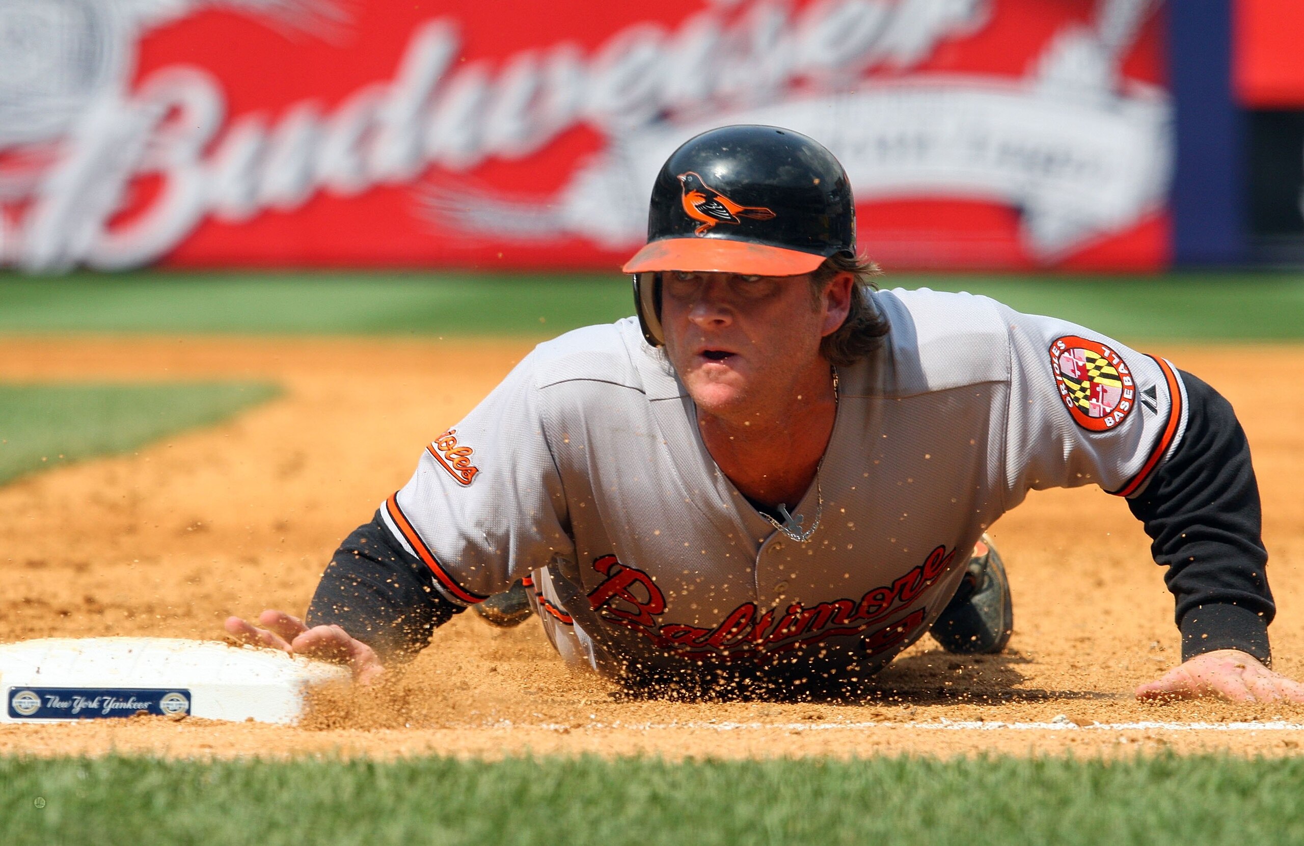NEW YORK - JULY 22: Greg Zaun #9 of the Baltimore Orioles dives back to first base against the New York Yankees on July 22, 2009 at Yankee Stadium in the Bronx borough of New York City. (Photo by Jim McIsaac/Getty Images) NEW YORK - JULY 22: Greg Zaun #9 of the Baltimore Orioles dives back to first base against the New York Yankees on July 22, 2009 at Yankee Stadium in the Bronx borough of New York City. (Photo by Jim McIsaac/Getty Images)
