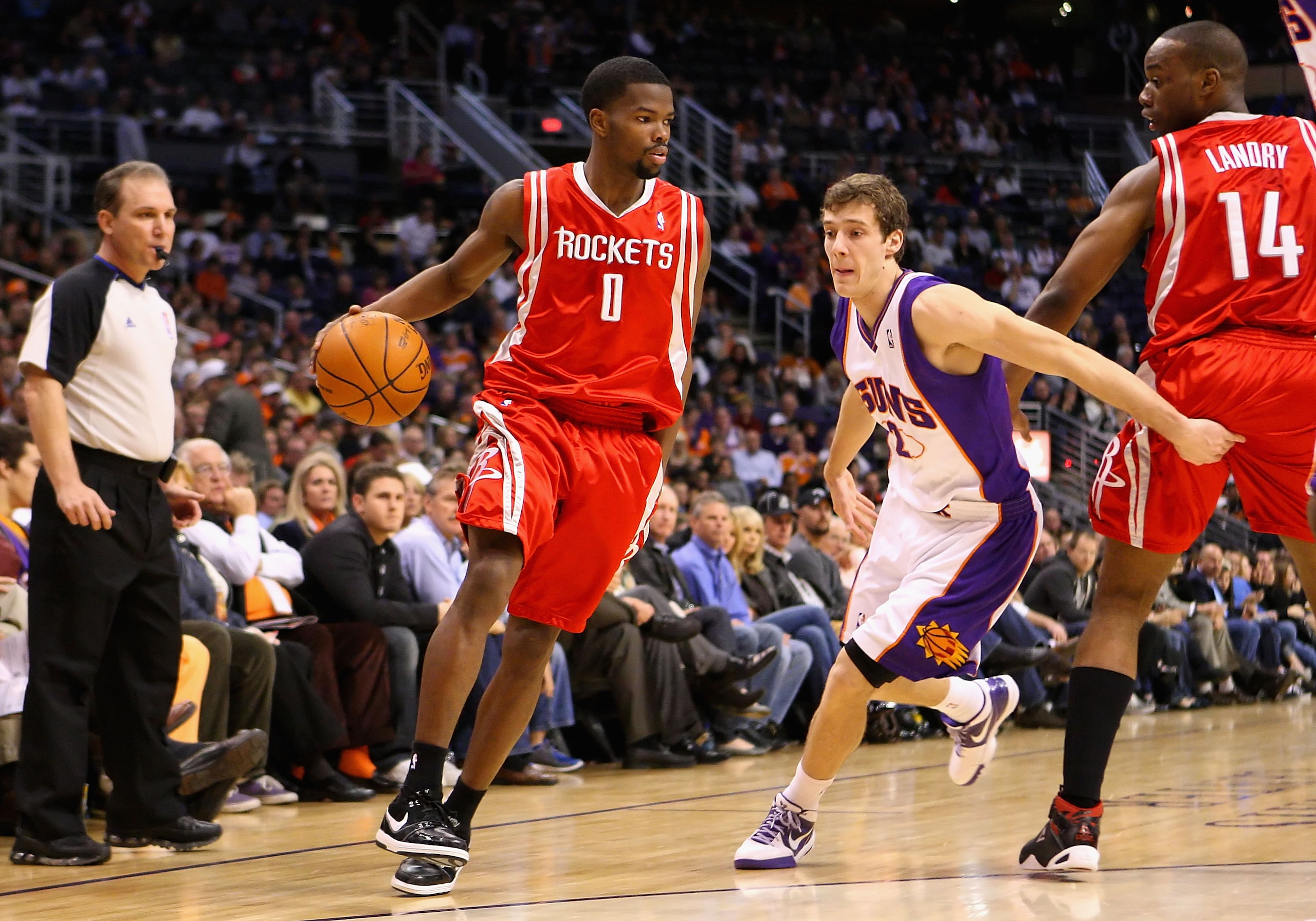 PHOENIX - JANUARY 06:  Aaron Brooks #1 of the Houston Rockets drives the ball past Goran Dragic #2 of the Phoenix Suns during the NBA game at US Airways Center on January 6, 2010 in Phoenix, Arizona. NOTE TO USER: User expressly acknowledges and agrees th