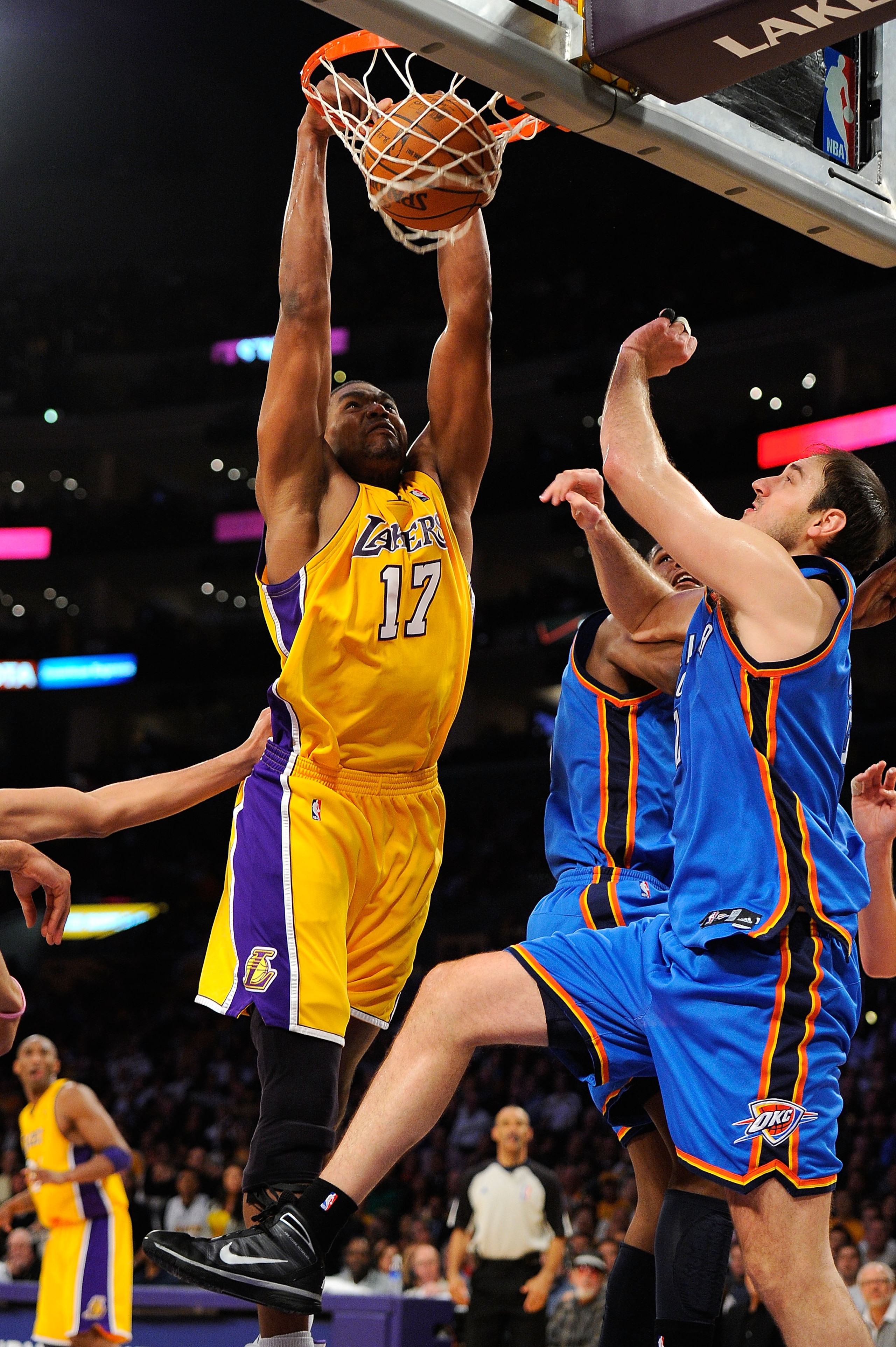 LOS ANGELES, CA - APRIL 27:  Andrew Bynum #17 of the Los Angeles Lakers dunks the ball over Nenad Krstic #12 of the Oklahoma City Thunder in the second half during Game Five of the Western Conference Quarterfinals of the 2010 NBA Playoffs at Staples Cente