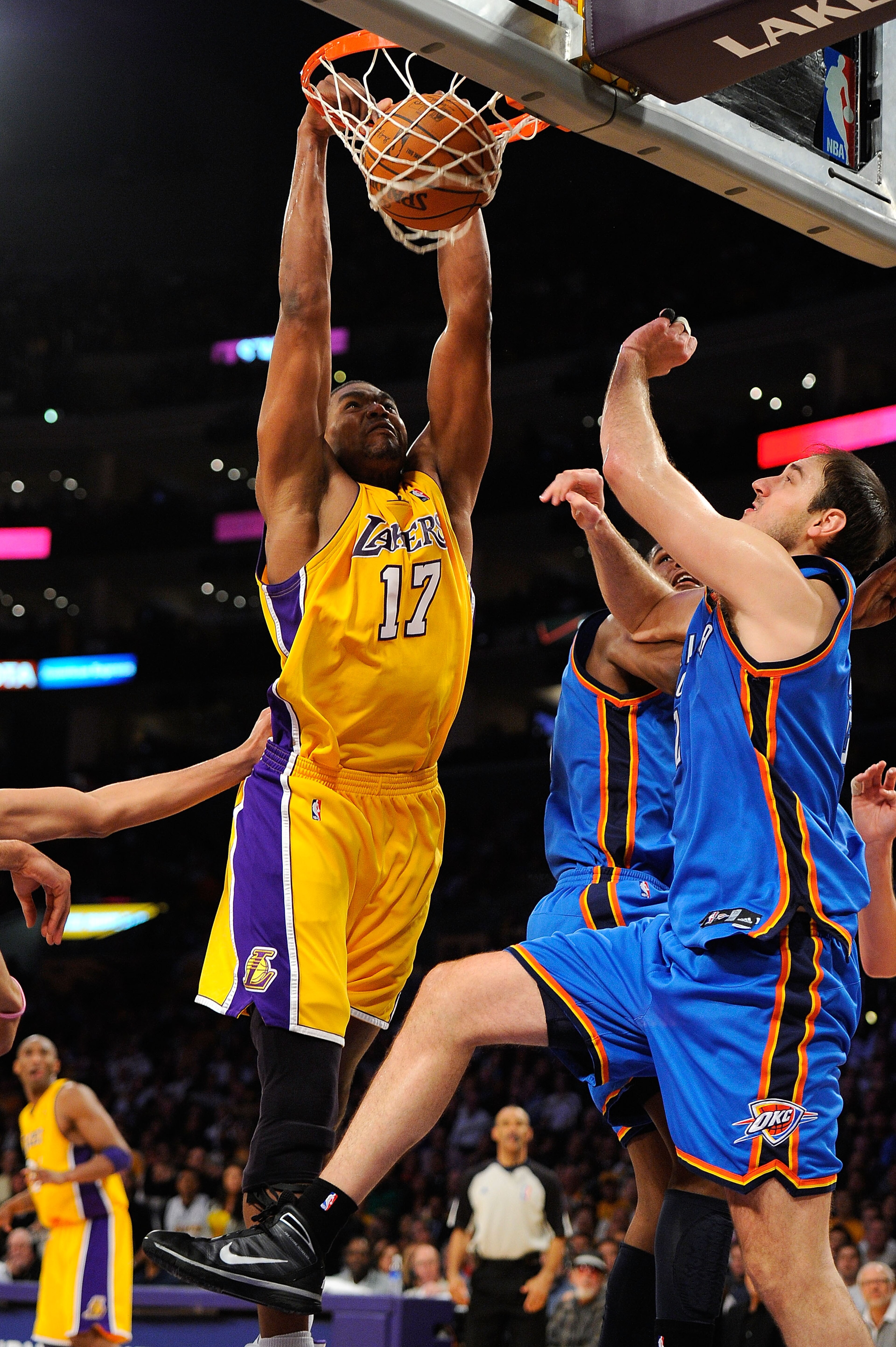 LOS ANGELES, CA - APRIL 27: Andrew Bynum #17 of the Los Angeles Lakers dunks the ball over Nenad Krstic #12 of the Oklahoma City Thunder in the second half during Game Five of the Western Conference Quarterfinals of the 2010 NBA Playoffs at Staples Cente LOS ANGELES, CA - APRIL 27: Andrew Bynum #17 of the Los Angeles Lakers dunks the ball over Nenad Krstic #12 of the Oklahoma City Thunder in the second half during Game Five of the Western Conference Quarterfinals of the 2010 NBA Playoffs at Staples Cente