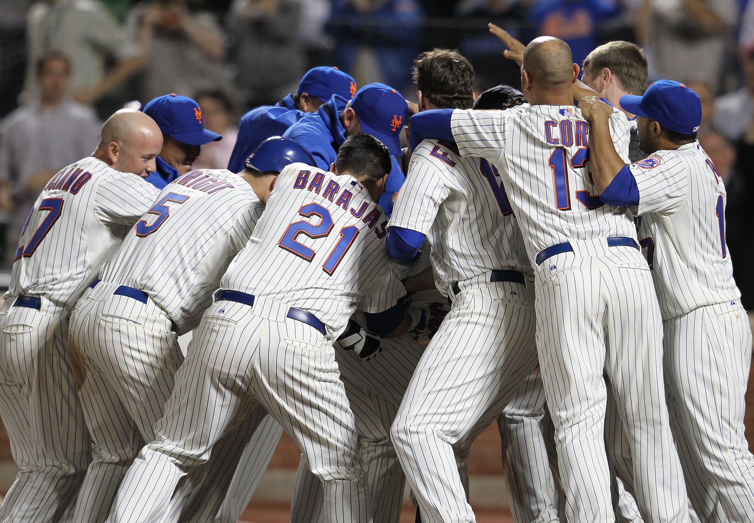 NEW YORK - JUNE 08: The New York Mets celebrate their extra innings win after a solo hom run by Ike Davis in the eleventh inning against the San Diego Padres on June 8, 2010 in the Flushing neighborhood of the Queens borough of New York City. (Photo by NEW YORK - JUNE 08: The New York Mets celebrate their extra innings win after a solo hom run by Ike Davis in the eleventh inning against the San Diego Padres on June 8, 2010 in the Flushing neighborhood of the Queens borough of New York City. (Photo by