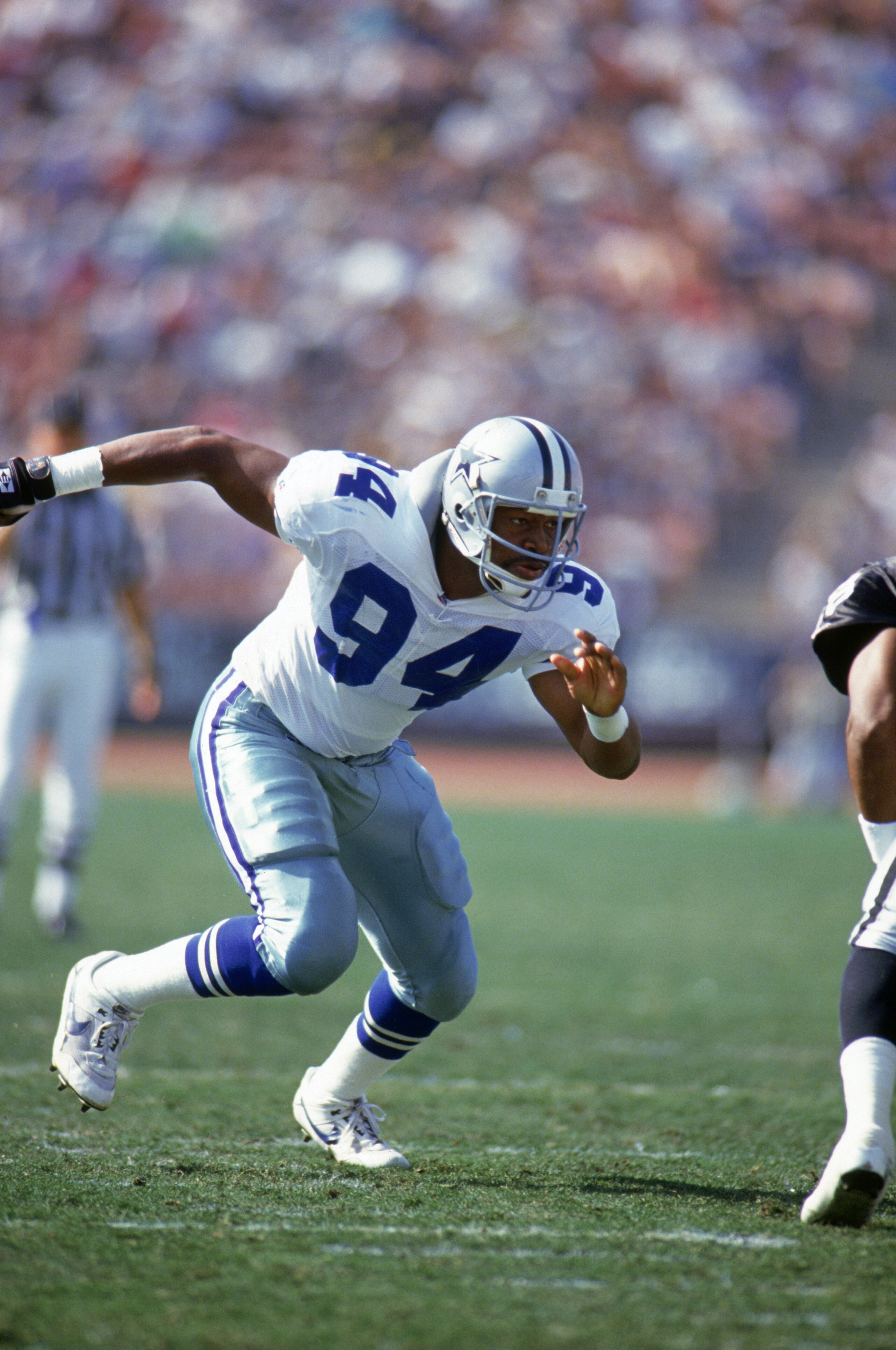 LOS ANGELES - OCTOBER 25:  Defensive end Charles Haley #94 of the Dallas Cowboys rushes the line of scrimmage during a game against the Los Angeles Raiders at Los Angeles Memorial Coliseum on October 25, 1992 in Los Angeles, California.  The Cowboys won 2