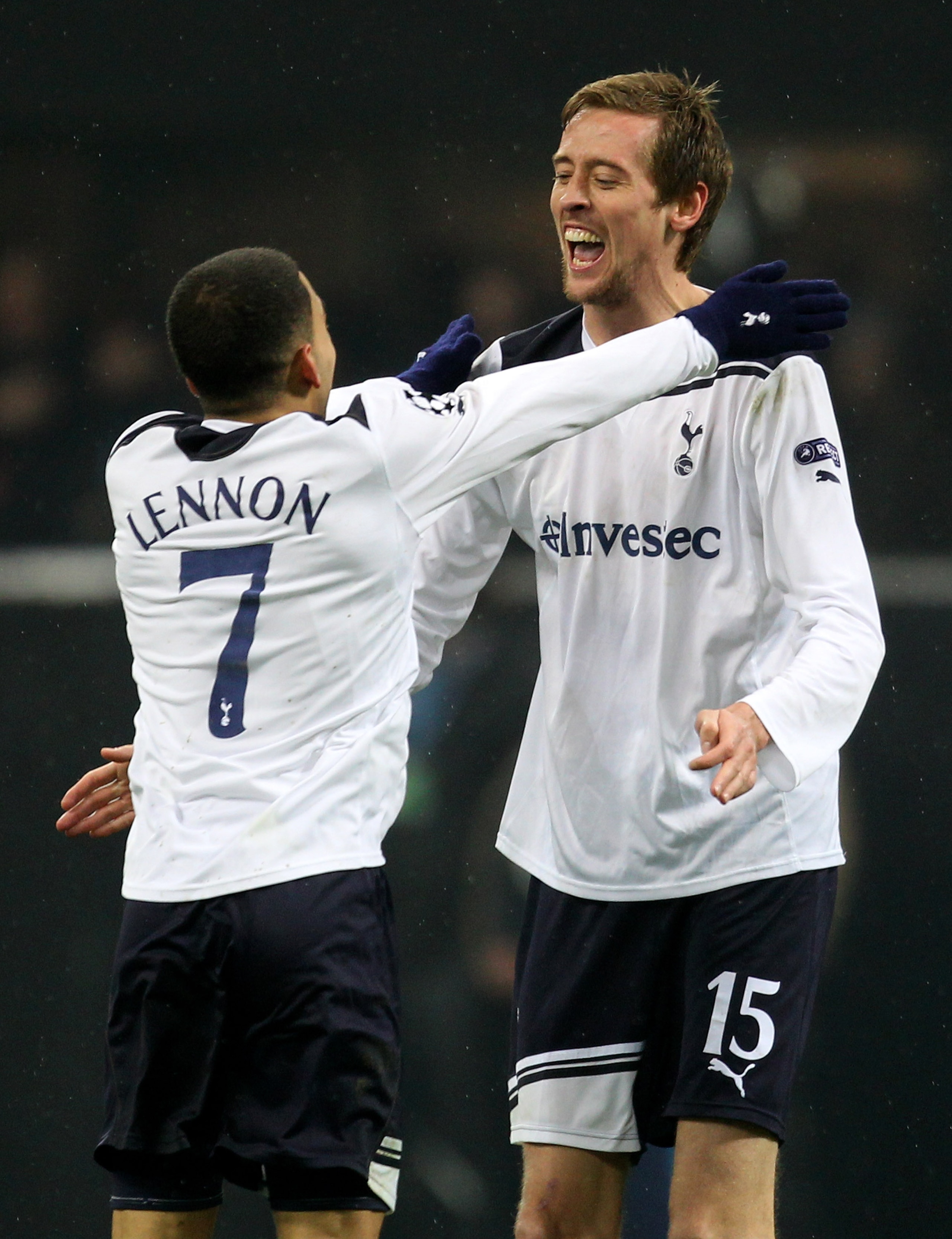 MILAN, ITALY - FEBRUARY 15: Peter Crouch of Tottenham Hotspur celebrates scoring the winning goal with team mate Aaron Lennon during the UEFA Champions League round of 16 first leg match between AC Milan and Tottenham Hotspur at Stadio Giuseppe Meazza on MILAN, ITALY - FEBRUARY 15: Peter Crouch of Tottenham Hotspur celebrates scoring the winning goal with team mate Aaron Lennon during the UEFA Champions League round of 16 first leg match between AC Milan and Tottenham Hotspur at Stadio Giuseppe Meazza on