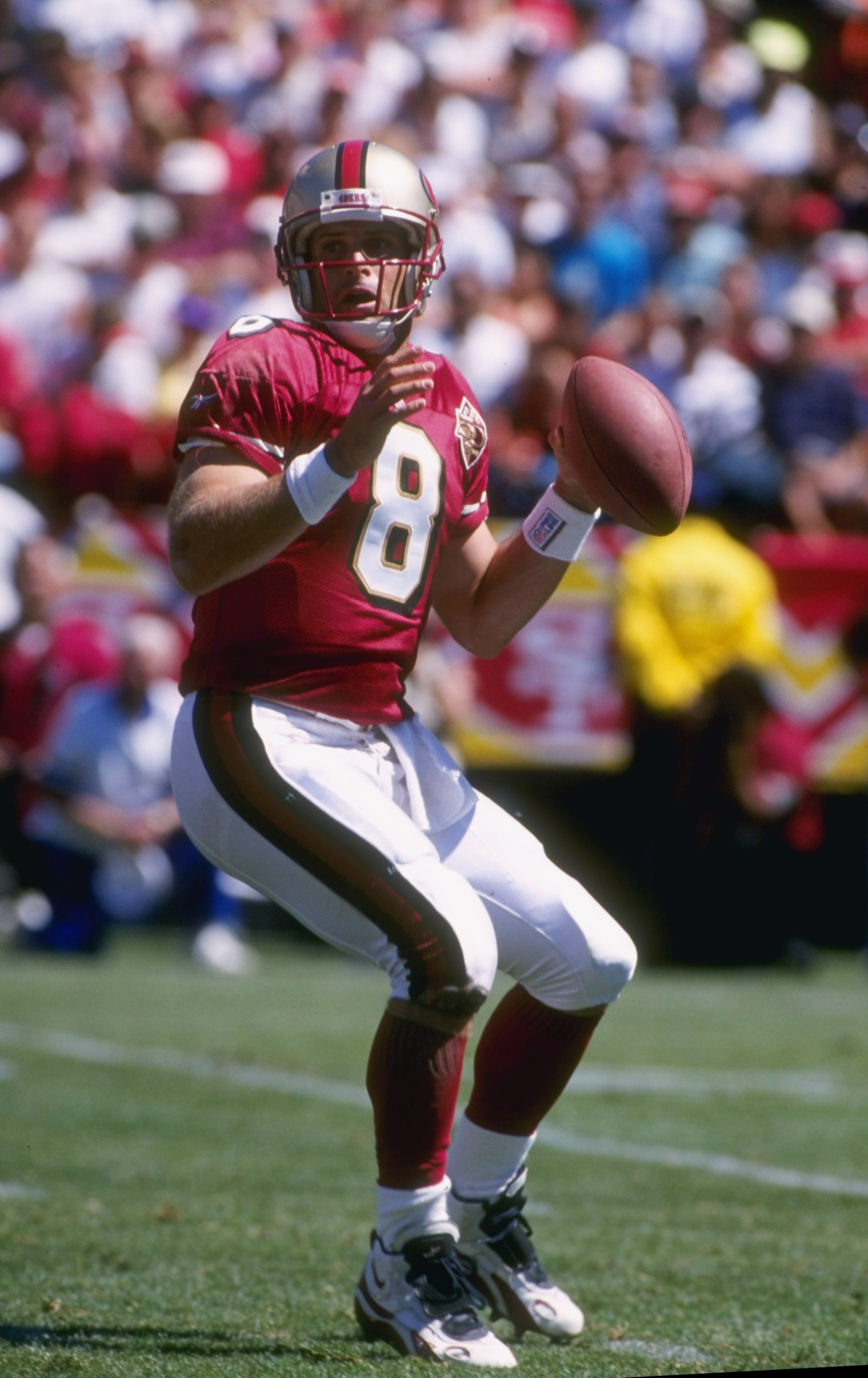 8 Sep 1996: Quarterback Steve Young #8 of the San Francisco 49ers looks down field for an open receiver as he sets his feet to throw a pass during the 49ers 34-0 victory over the St. Louis Rams at 3Com Park in San Francisco, California.  Mandatory Credit: