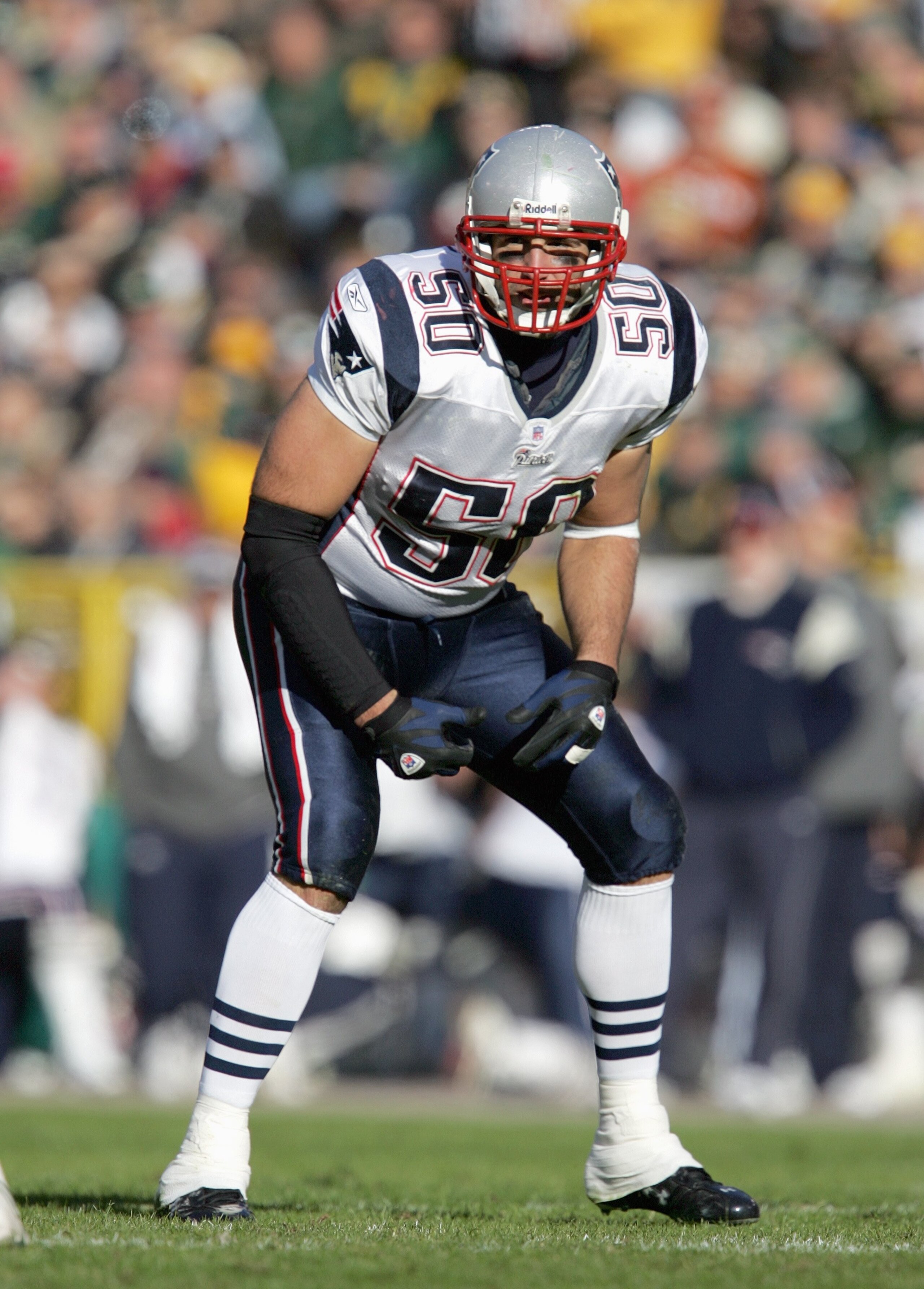 GREEN BAY, WI - NOVEMBER 19: Mike Vrabel #50 of the New England Patriots gets ready on the line of scrimmage during the game against the Green Bay Packers on November 19, 2006 at Lambeau Field in Green Bay, Wisconsin. The Patriots defeated the Packers 35-