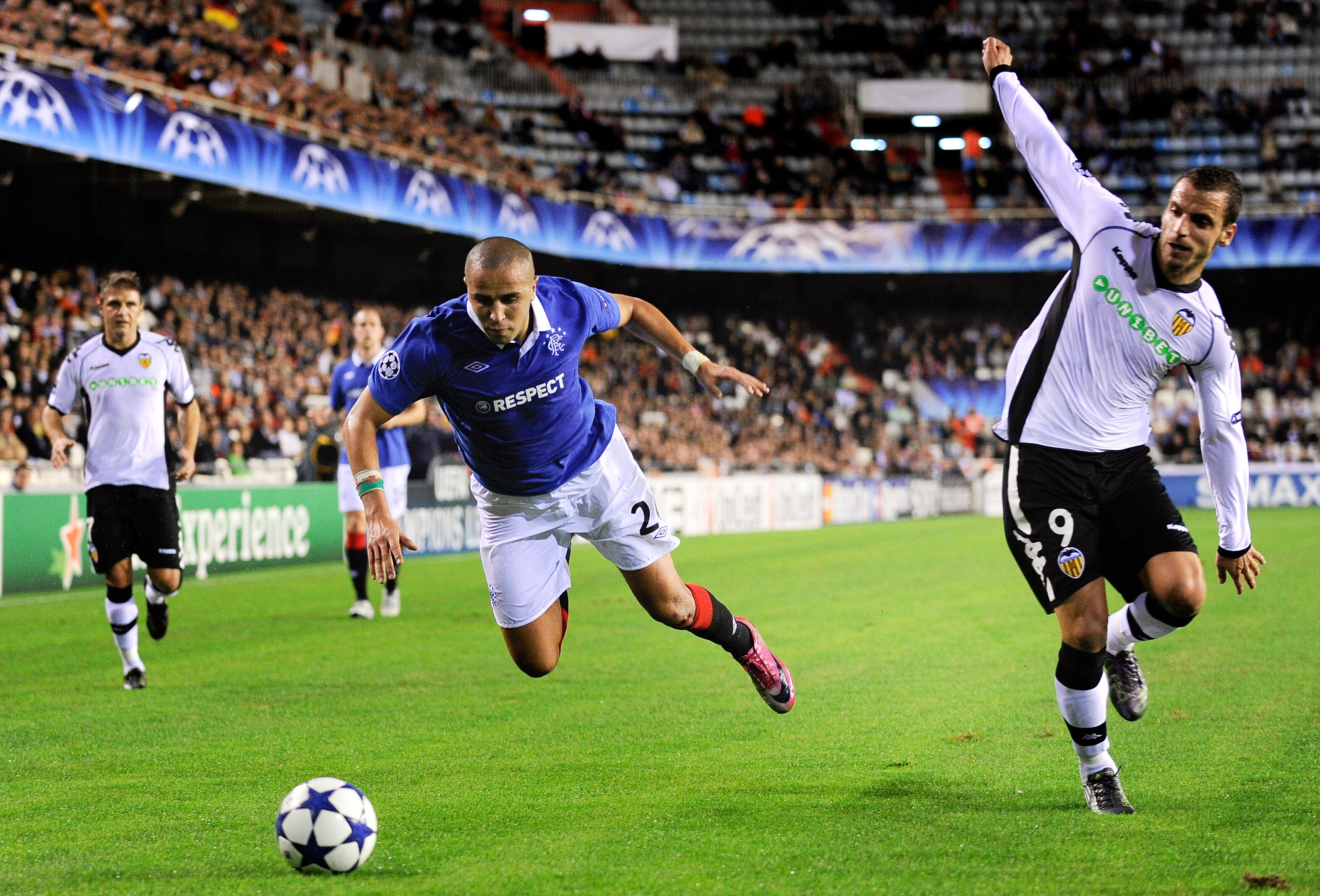VALENCIA, SPAIN - NOVEMBER 02:  Madjid Bougherra of Glasgow Rangers (L) and Roberto Soldado of Valencia CF duels for a ball during their UEFA Champions League group C match between Valencia CF and Glasgow Rangers at the Mestalla Stadium on November 2, 201