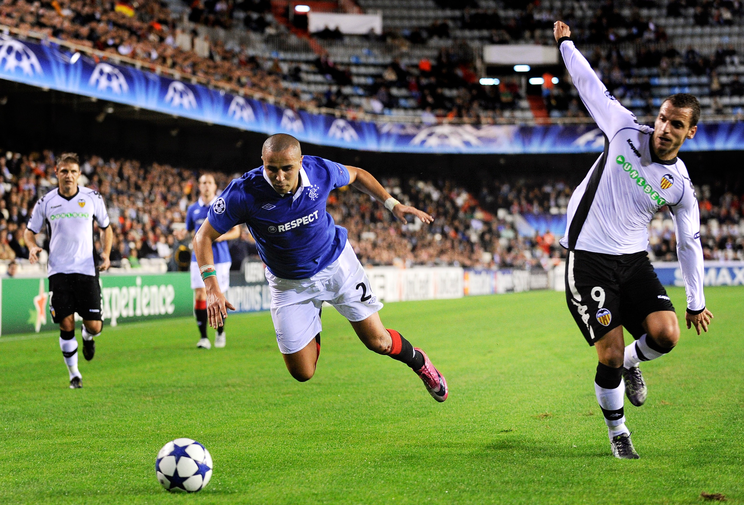 VALENCIA, SPAIN - NOVEMBER 02: Madjid Bougherra of Glasgow Rangers (L) and Roberto Soldado of Valencia CF duels for a ball during their UEFA Champions League group C match between Valencia CF and Glasgow Rangers at the Mestalla Stadium on November 2, 201 VALENCIA, SPAIN - NOVEMBER 02: Madjid Bougherra of Glasgow Rangers (L) and Roberto Soldado of Valencia CF duels for a ball during their UEFA Champions League group C match between Valencia CF and Glasgow Rangers at the Mestalla Stadium on November 2, 201
