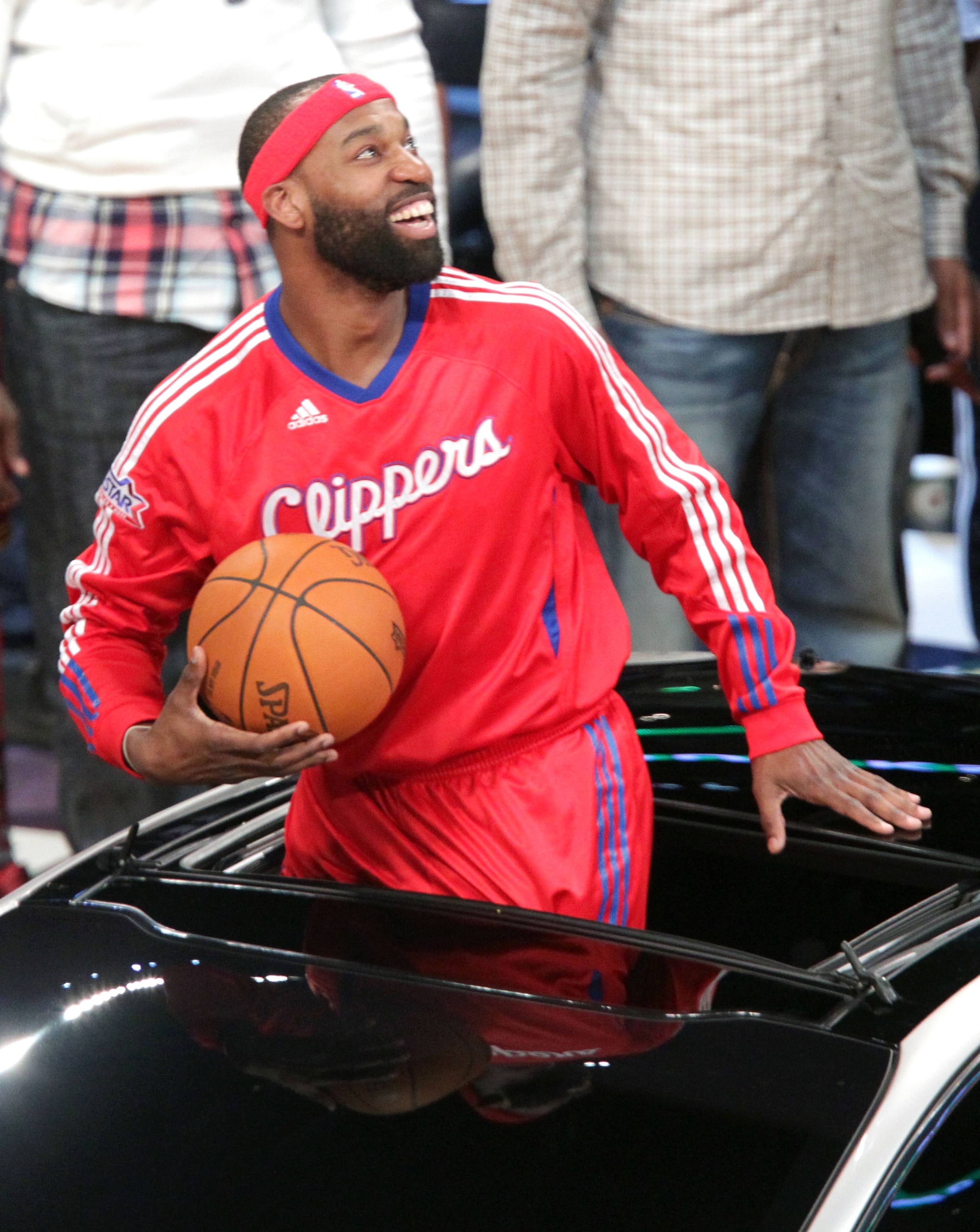 LOS ANGELES, CA - FEBRUARY 19:  NBA player Baron Davis of the L.A. Clippers passes the ball from inside the car to teammate, Blake Griffin, and he attempts a slam dunk, during the Sprite Slam Dunk Contest apart of NBA All-Star Saturday Night at Staples Ce