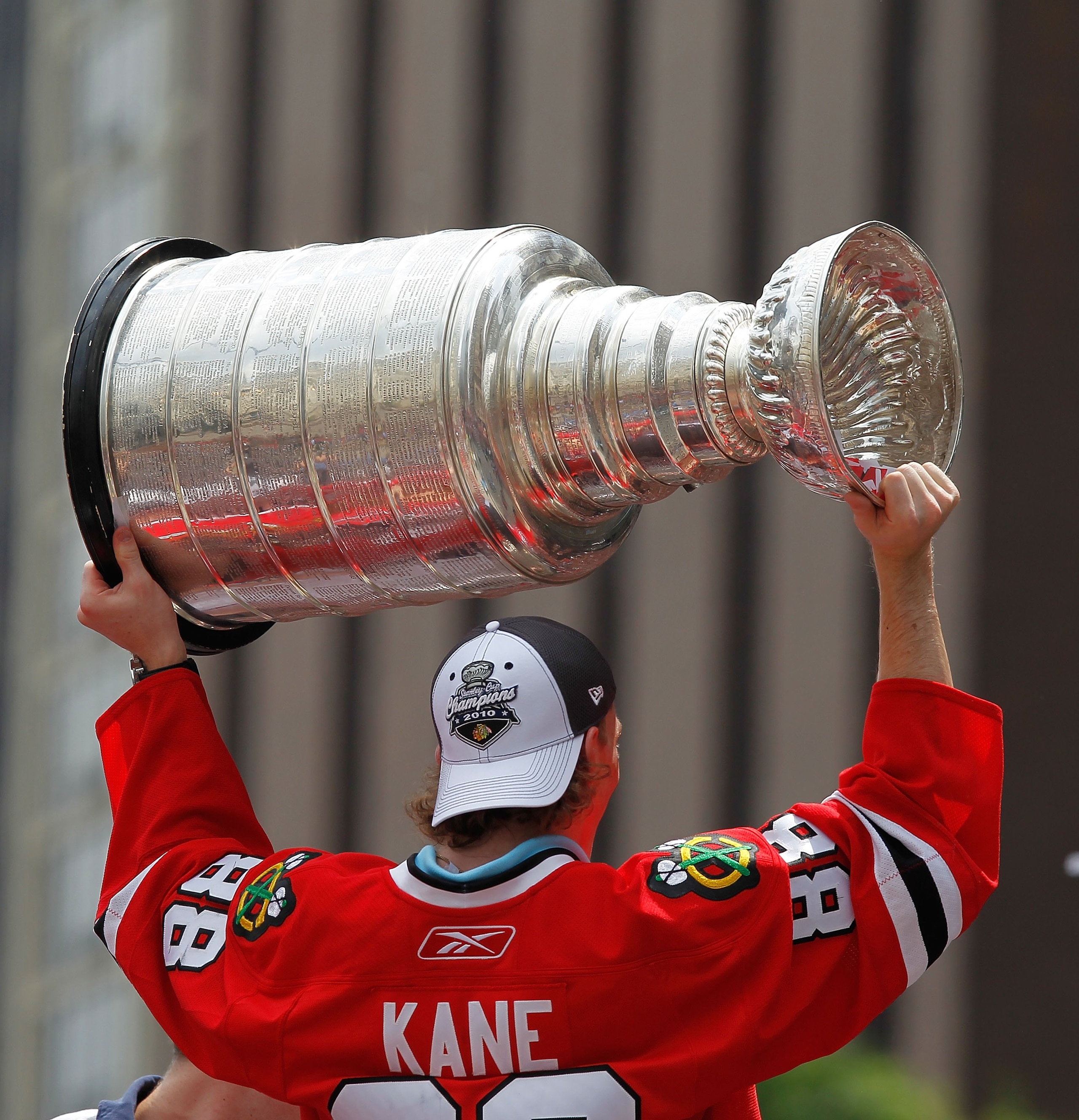 CHICAGO - JUNE 11: Patrick Kane #88 hoists the cup during the Chicago Blackhawks Stanley Cup victory parade and rally on June 11, 2010 in Chicago, Illinois. (Photo by Jonathan Daniel/Getty Images)