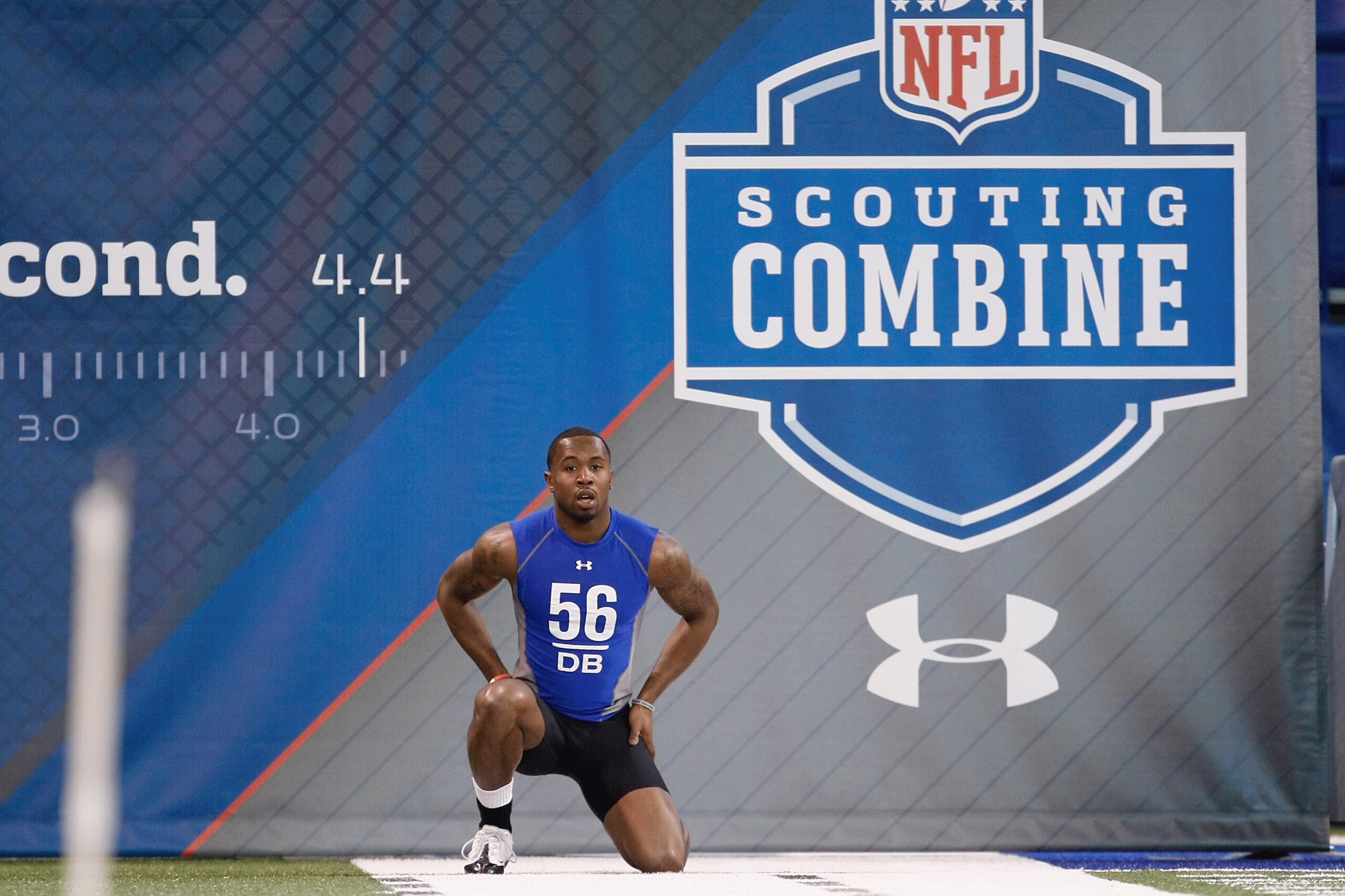 INDIANAPOLIS, IN - FEBRUARY 24:  Defensive back Donald Washington of Ohio State kneels down as he gets ready to run the 40 yard dash during the NFL Scouting Combine presented by Under Armour at Lucas Oil Stadium on February 24, 2009 in Indianapolis, India