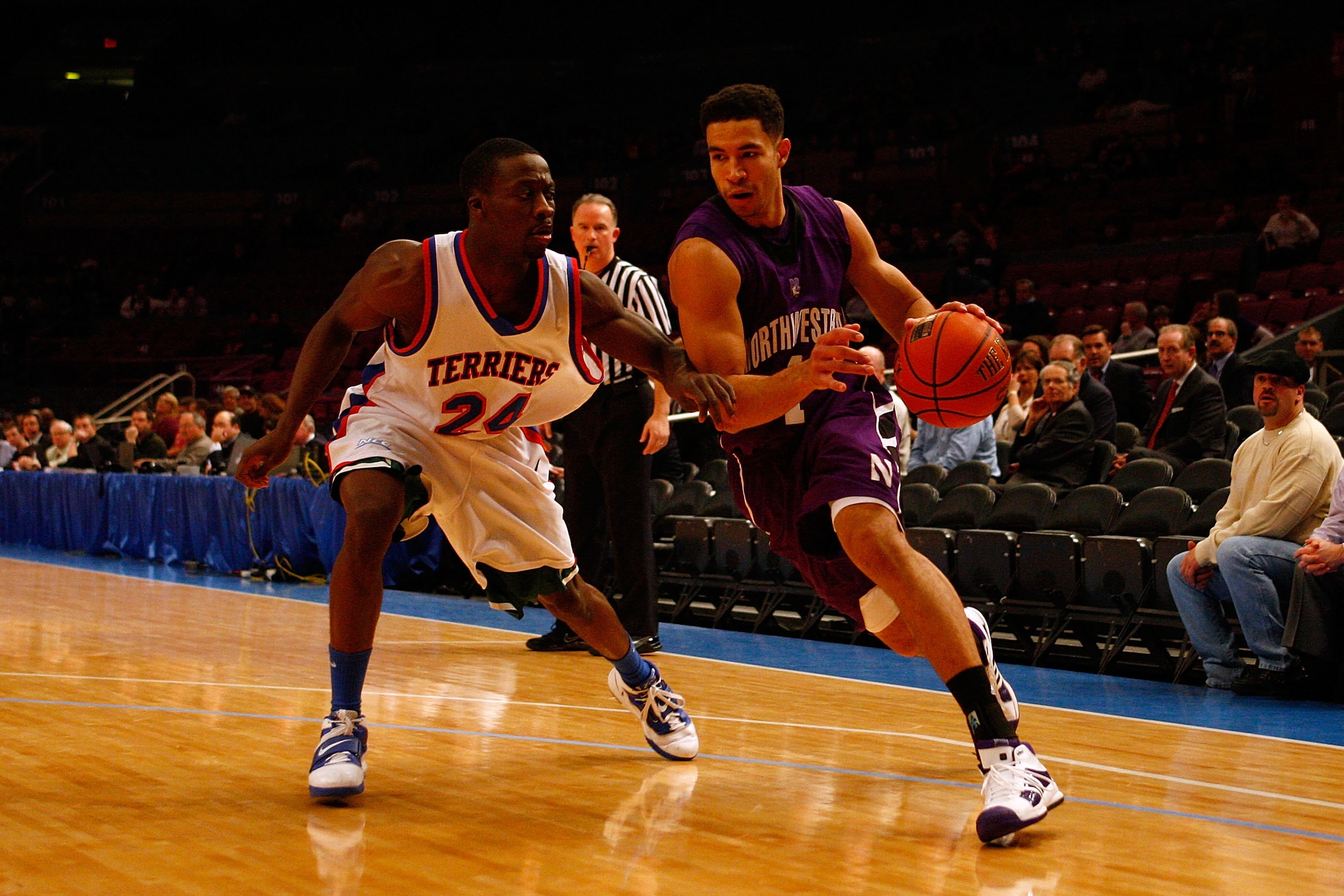 NEW YORK, NY - DECEMBER 20: Drew Crawford #1 of the Northwestern Wildcats drives against Akeem Bennett #24 of the St. Francis Terriers during the Madison Square Garden Holiday Festival at Madison Square Garden on December 20, 2010 in New York City. (Pho NEW YORK, NY - DECEMBER 20: Drew Crawford #1 of the Northwestern Wildcats drives against Akeem Bennett #24 of the St. Francis Terriers during the Madison Square Garden Holiday Festival at Madison Square Garden on December 20, 2010 in New York City. (Pho