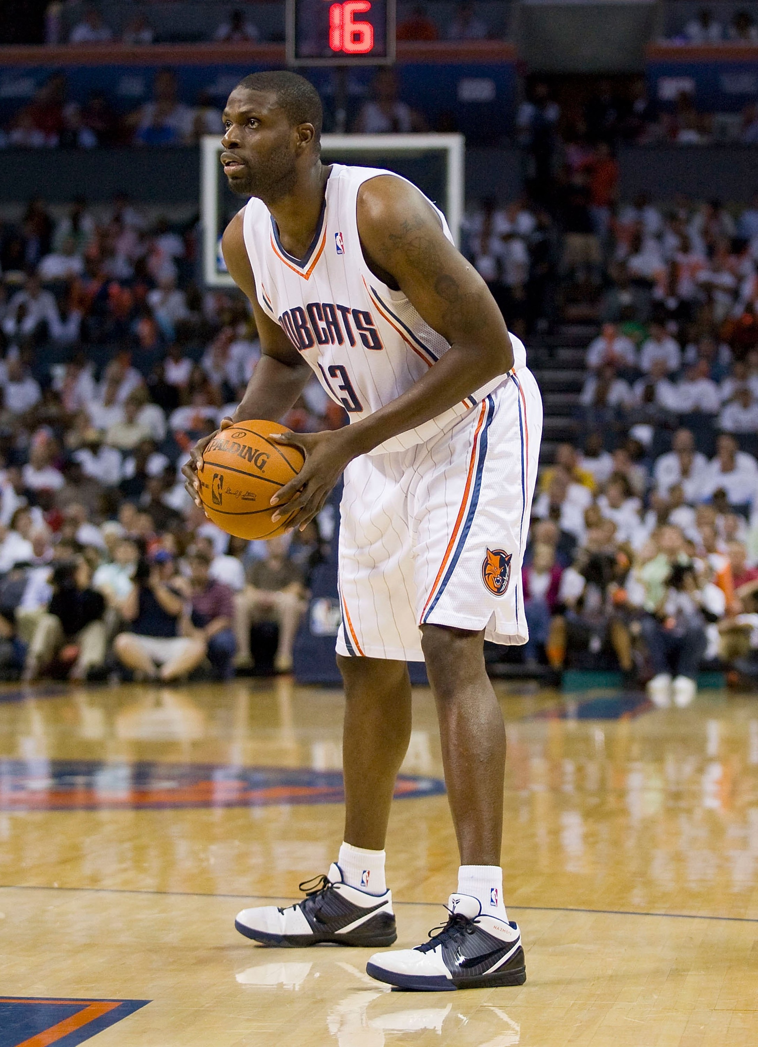 CHARLOTTE, NC - APRIL 26: Nazr Mohammed #13 of the Charlotte Bobcats looks for an open teammate against the Orlando Magic at Time Warner Cable Arena on April 26, 2010 in Charlotte, North Carolina.  The Magic defeated the Bobcats 99-90 to complete the four