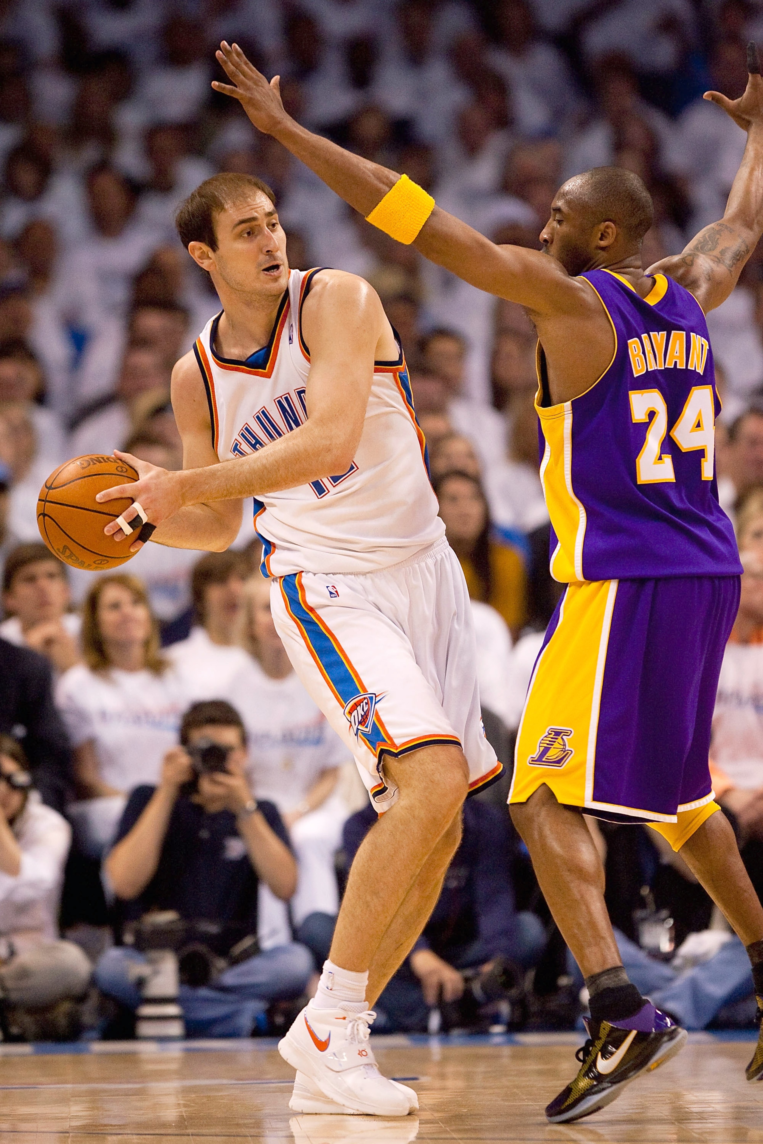 OKLAHOMA CITY - APRIL 24: Nenad Krstic #12 of the Oklahoma City Thunder looks to pass the ball against Kobe Bryant #24 of the Los Angeles Lakers during Game Four of the Western Conference Quarterfinals of the 2010 NBA Playoffs on April 24, 2010 at the For