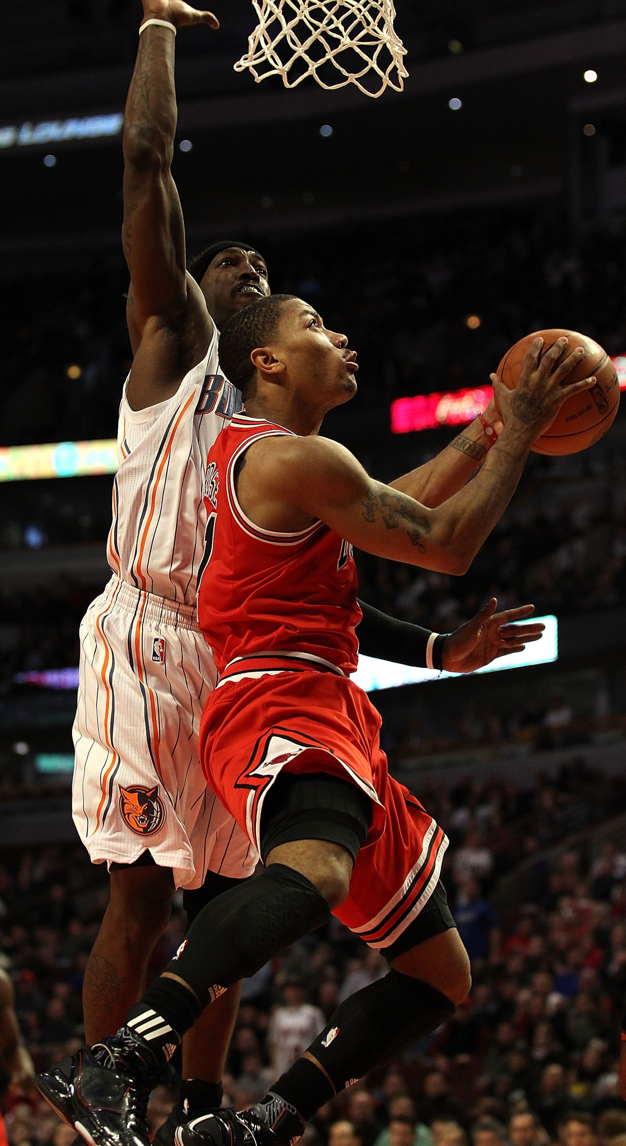 CHICAGO, IL - FEBRUARY 15: Derrick Rose #1 of the Chicago Bulls goes up for a shot against Gerald Wallace #3 of the Charlotte Bobcats at the United Center on February 15, 2011 in Chicago, Illinois. The Bulls defeated the Bobcats 106-94. NOTE TO USER: User