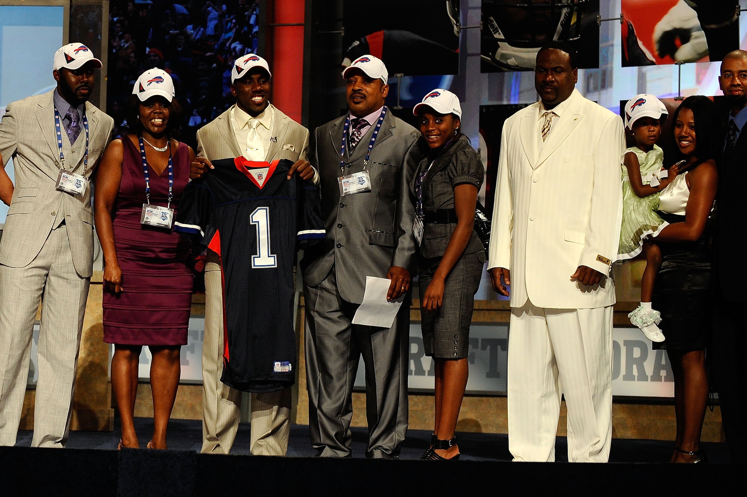 NEW YORK - APRIL 22:  C.J. Spiller from the Clemson Tigers holds up a Buffalo Bills jersey as he poses with friends and family after he was selected number 9 overall by the Bills during the first round of the 2010 NFL Draft at Radio City Music Hall on Apr