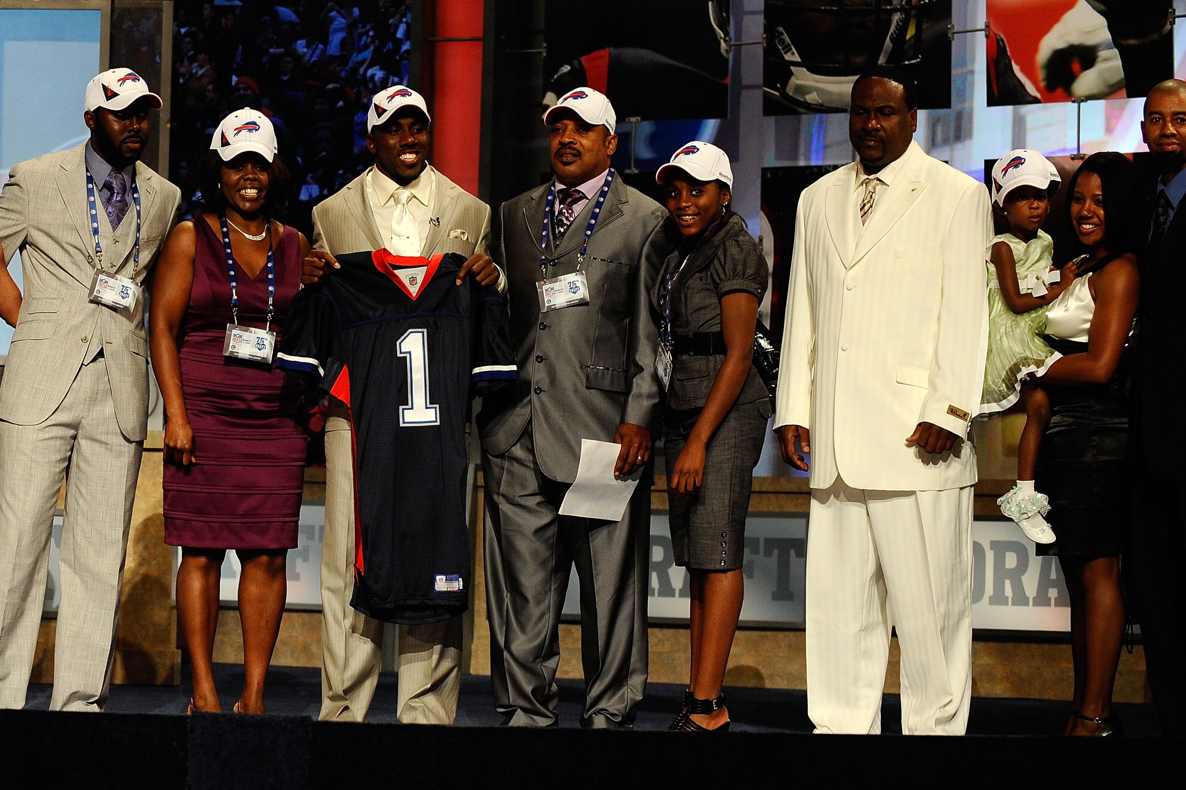 NEW YORK - APRIL 22:  C.J. Spiller from the Clemson Tigers holds up a Buffalo Bills jersey as he poses with friends and family after he was selected number 9 overall by the Bills during the first round of the 2010 NFL Draft at Radio City Music Hall on Apr
