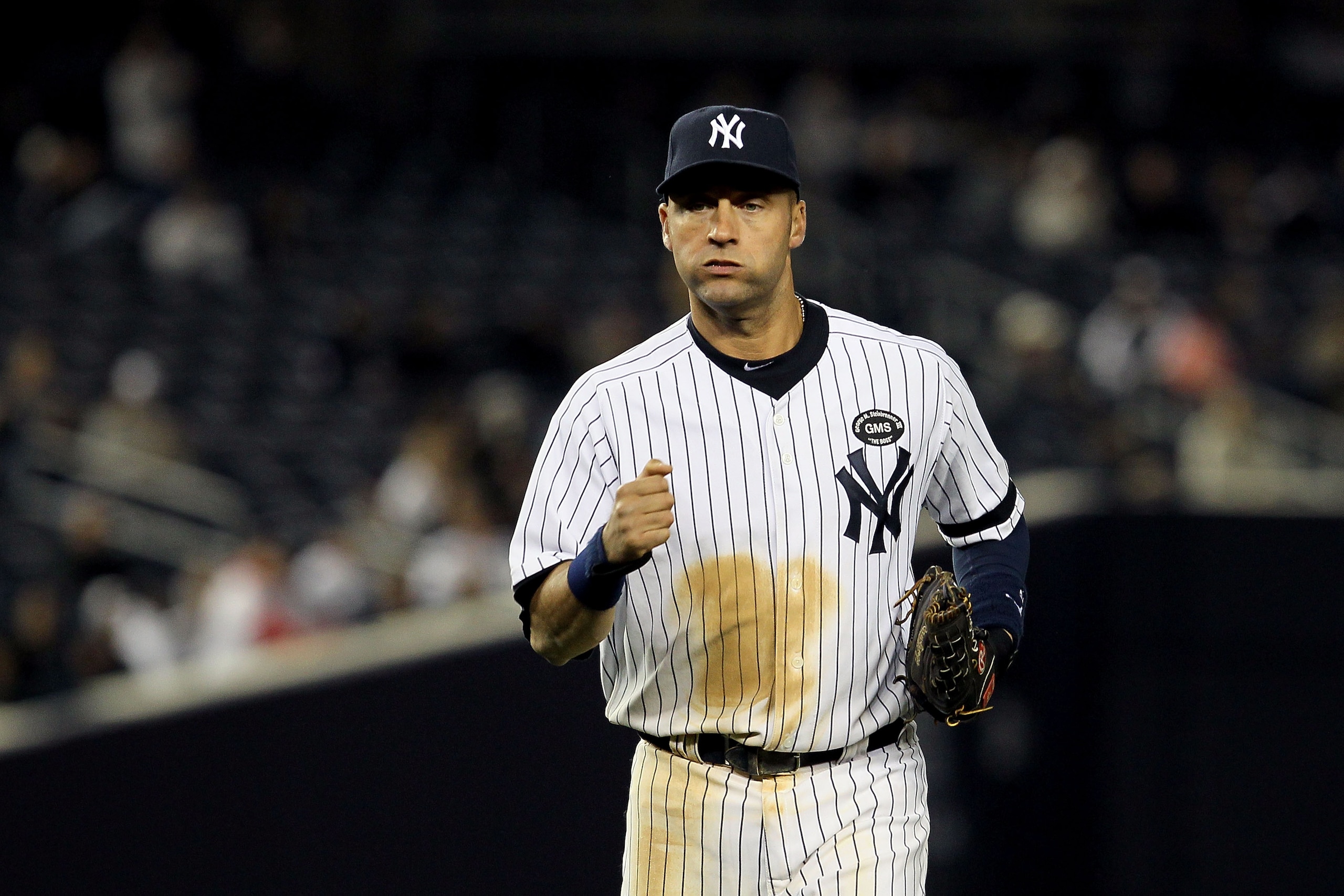 NEW YORK - OCTOBER 19:  Derek Jeter #2 of the New York Yankees runs back to the dugout against the Texas Rangers in Game Four of the ALCS during the 2010 MLB Playoffs at Yankee Stadium on October 19, 2010 in the Bronx borough of New York City. The Rangers