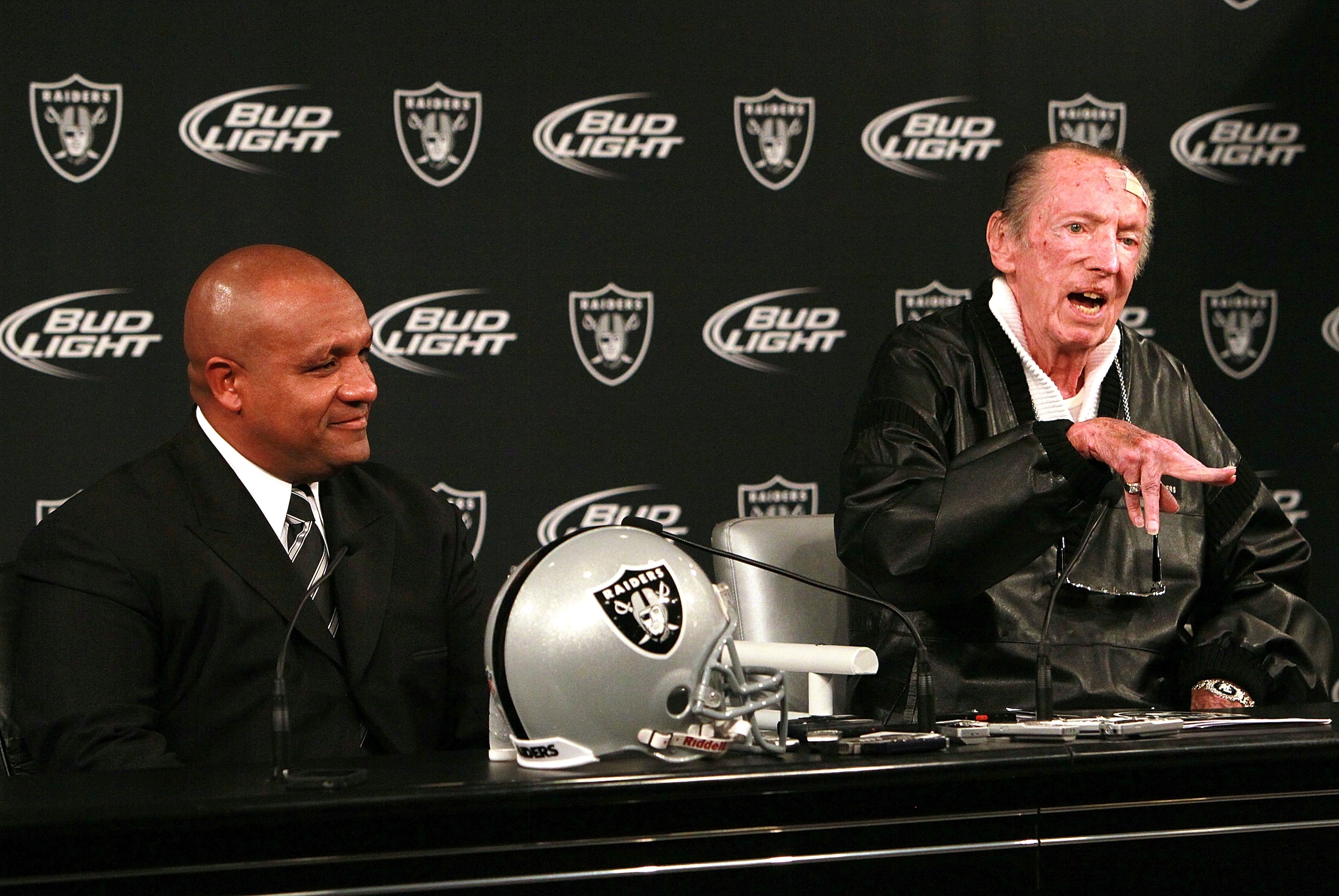 ALAMEDA, CA - JANUARY 18: New Oakland Raiders coach Hue Jackson (L) looks on as Raiders owner Al Davis (R) speaks to reporters after introducing Jackson as the new head coach of the Oakland Raiders on January 18, 2011 in Alameda, California. Hue Jackson ALAMEDA, CA - JANUARY 18: New Oakland Raiders coach Hue Jackson (L) looks on as Raiders owner Al Davis (R) speaks to reporters after introducing Jackson as the new head coach of the Oakland Raiders on January 18, 2011 in Alameda, California. Hue Jackson