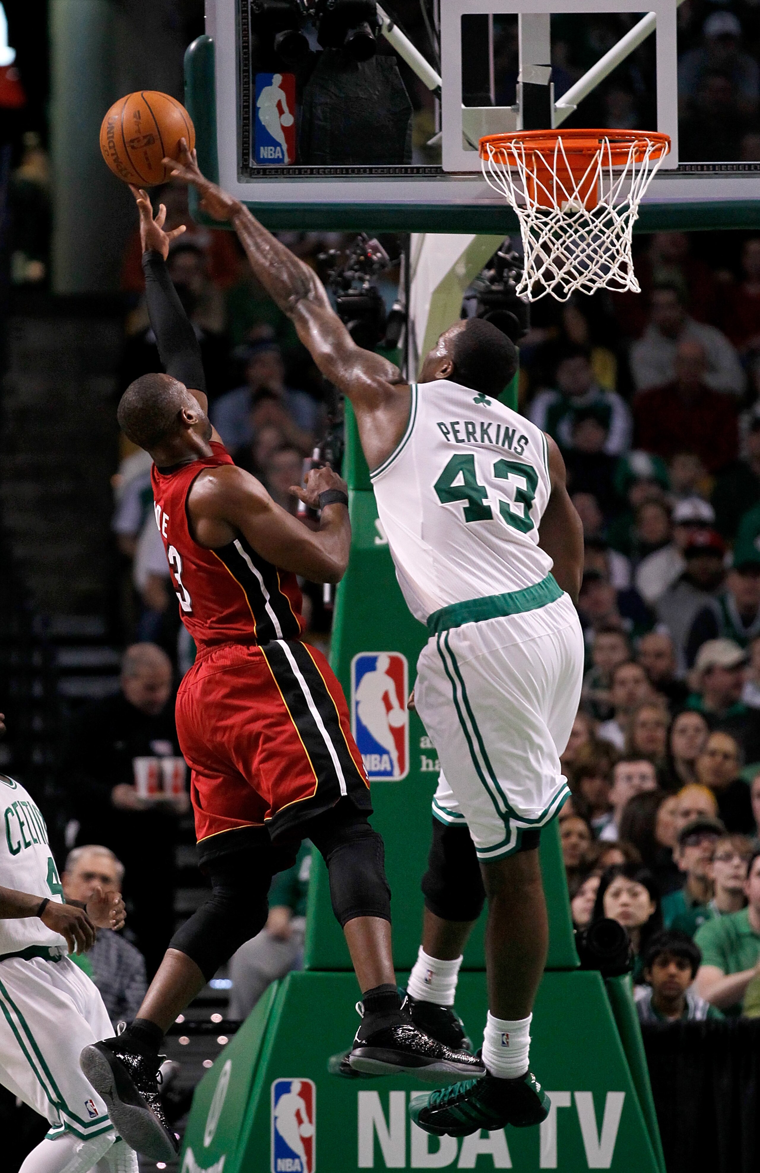 BOSTON - FEBRUARY 13: Dwyane Wade #3 of the Miami Heat goes to the basket against Kendrick Perkins #43 of the Boston Celtics at TD Garden on February 13, 2011 in Boston, Massachusetts. NOTE TO USER: User expressly acknowledges and agrees that, by downloa BOSTON - FEBRUARY 13: Dwyane Wade #3 of the Miami Heat goes to the basket against Kendrick Perkins #43 of the Boston Celtics at TD Garden on February 13, 2011 in Boston, Massachusetts. NOTE TO USER: User expressly acknowledges and agrees that, by downloa