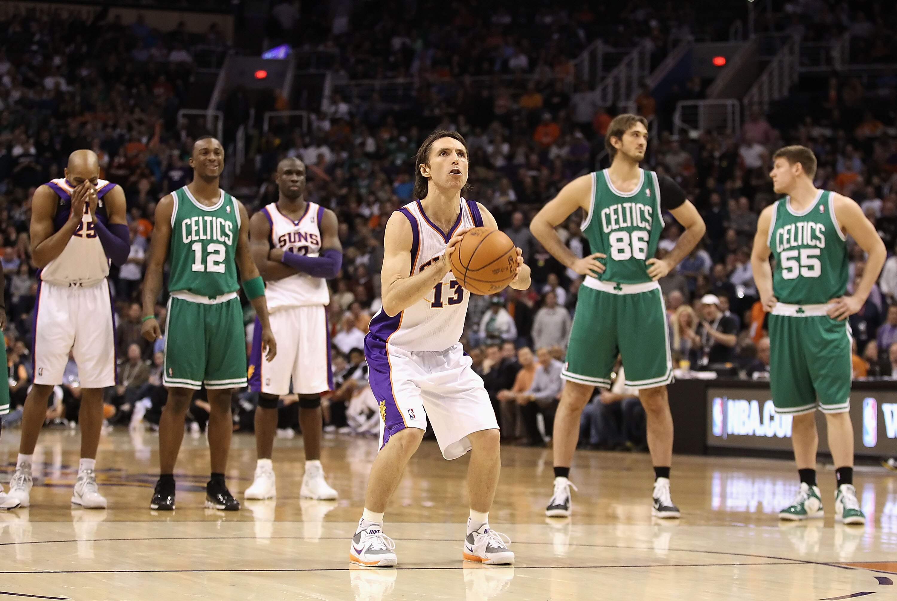 PHOENIX, AZ - JANUARY 28:  Steve Nash #13 of the Phoenix Suns shoots free throw shots after the Boston Celtics were charged with double technical fouls during the NBA game at US Airways Center on January 28, 2011 in Phoenix, Arizona.   The Suns defeated t