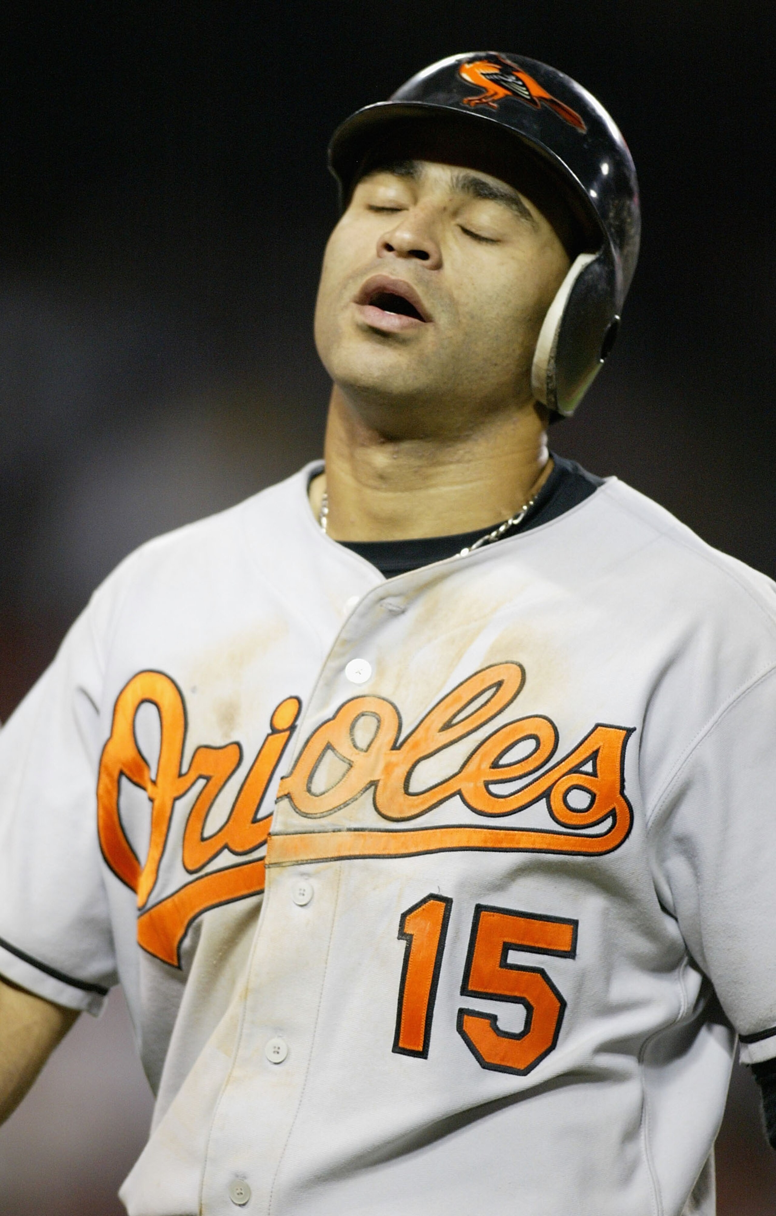 ANAHEIM, CA - AUGUST 11:  Jerry Hairston #15 of the Baltimore Orioles reacts to flying out on a hard hit ball to center field against the Anaheim Angels on August 11, 2004 at Angel Stadium of Anaheim in Anaheim, California. (Photo by Streeter Lecka/Getty 