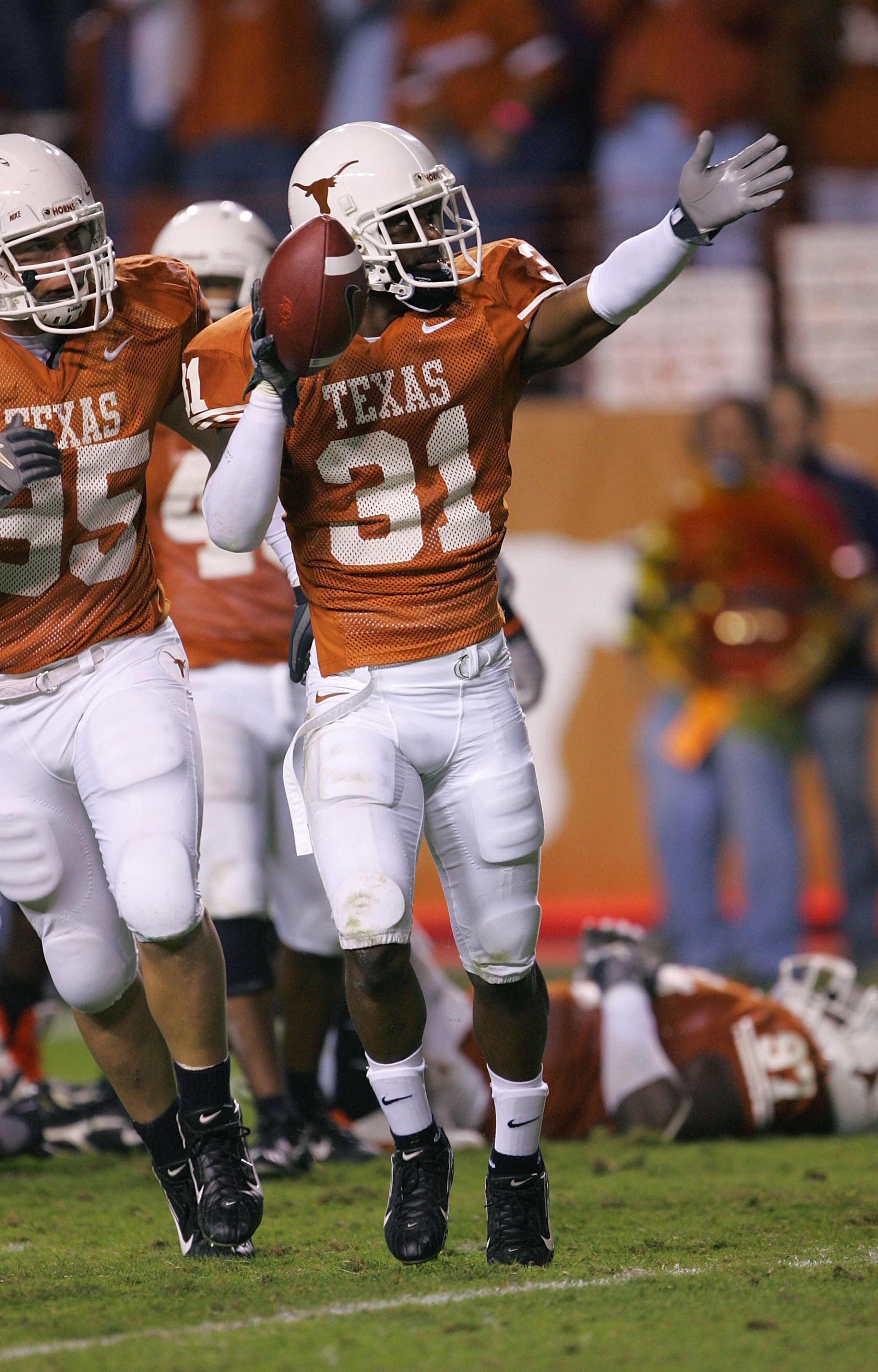 AUSTIN, TX - NOVEMBER 4:   Defensive back Aaron Ross #31 of the Texas Longhorns celebrates after intercepting a pass on the Oklahoma State Cowboys nine yard line, setting up a Texas touchdown, on November 4, 2006 at Texas Memorial Stadium in Austin, Texas
