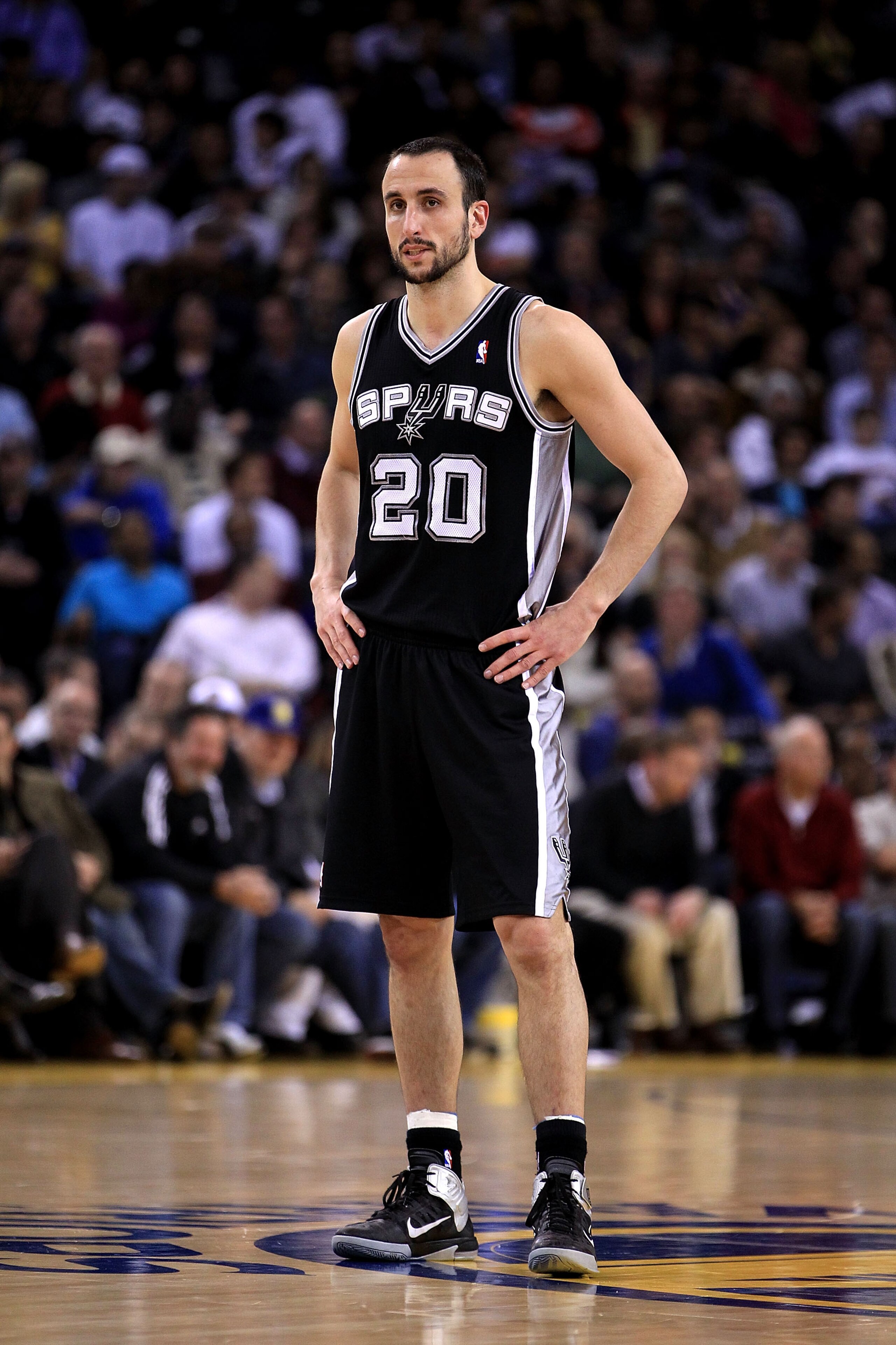 OAKLAND, CA - JANUARY 24:  Manu Ginobili #20 of the San Antonio Spurs in action against the Golden State Warriors at Oracle Arena on January 24, 2011 in Oakland, California.  NOTE TO USER: User expressly acknowledges and agrees that, by downloading and or