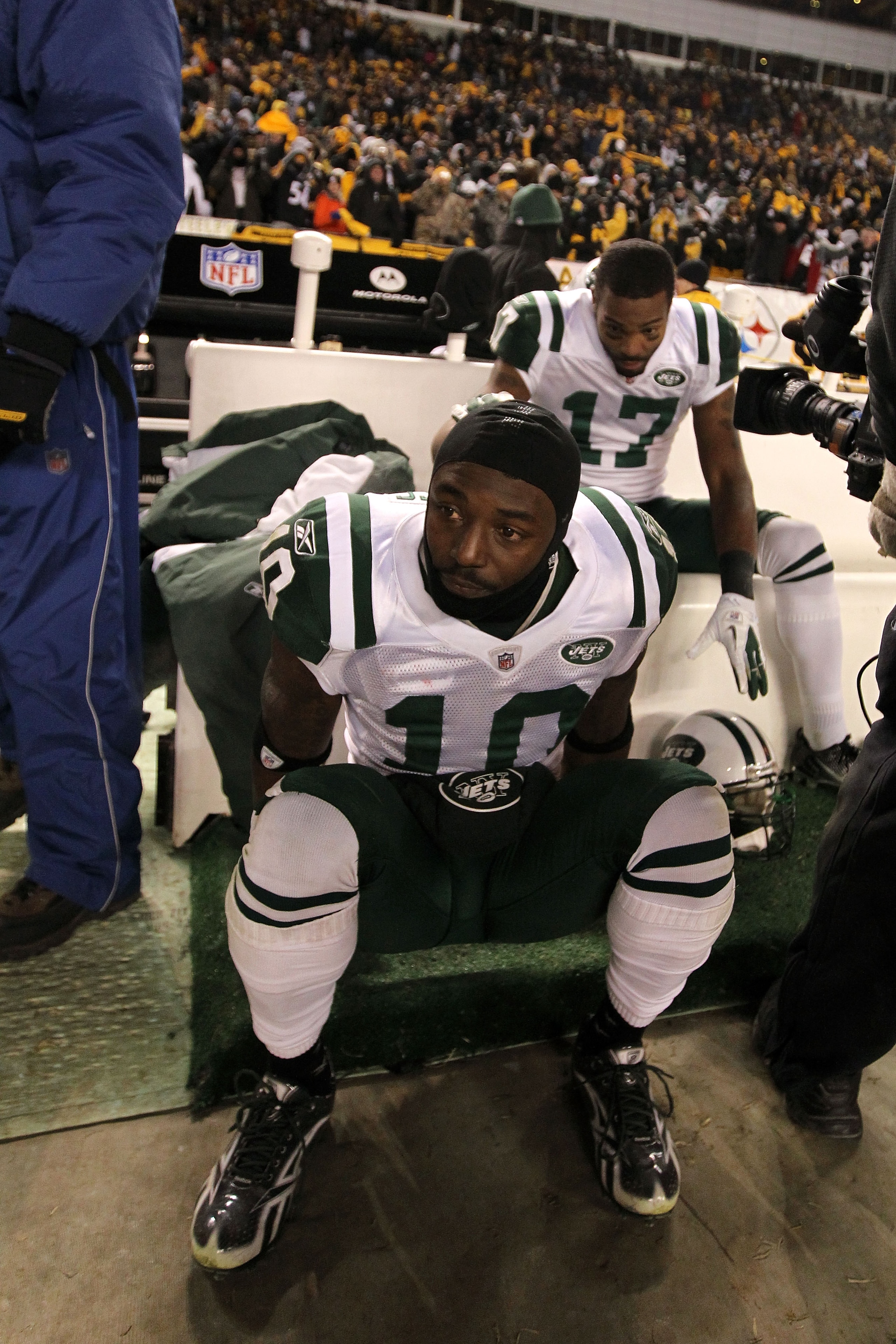 PITTSBURGH, PA - JANUARY 23: Santonio Holmes #10 and Braylon Edwards #17 of the New York Jets sit dejected after being defeated 24 to 19 by the Pittsburgh Steelers in the 2011 AFC Championship game at Heinz Field on January 23, 2011 in Pittsburgh, Pennsy PITTSBURGH, PA - JANUARY 23: Santonio Holmes #10 and Braylon Edwards #17 of the New York Jets sit dejected after being defeated 24 to 19 by the Pittsburgh Steelers in the 2011 AFC Championship game at Heinz Field on January 23, 2011 in Pittsburgh, Pennsy