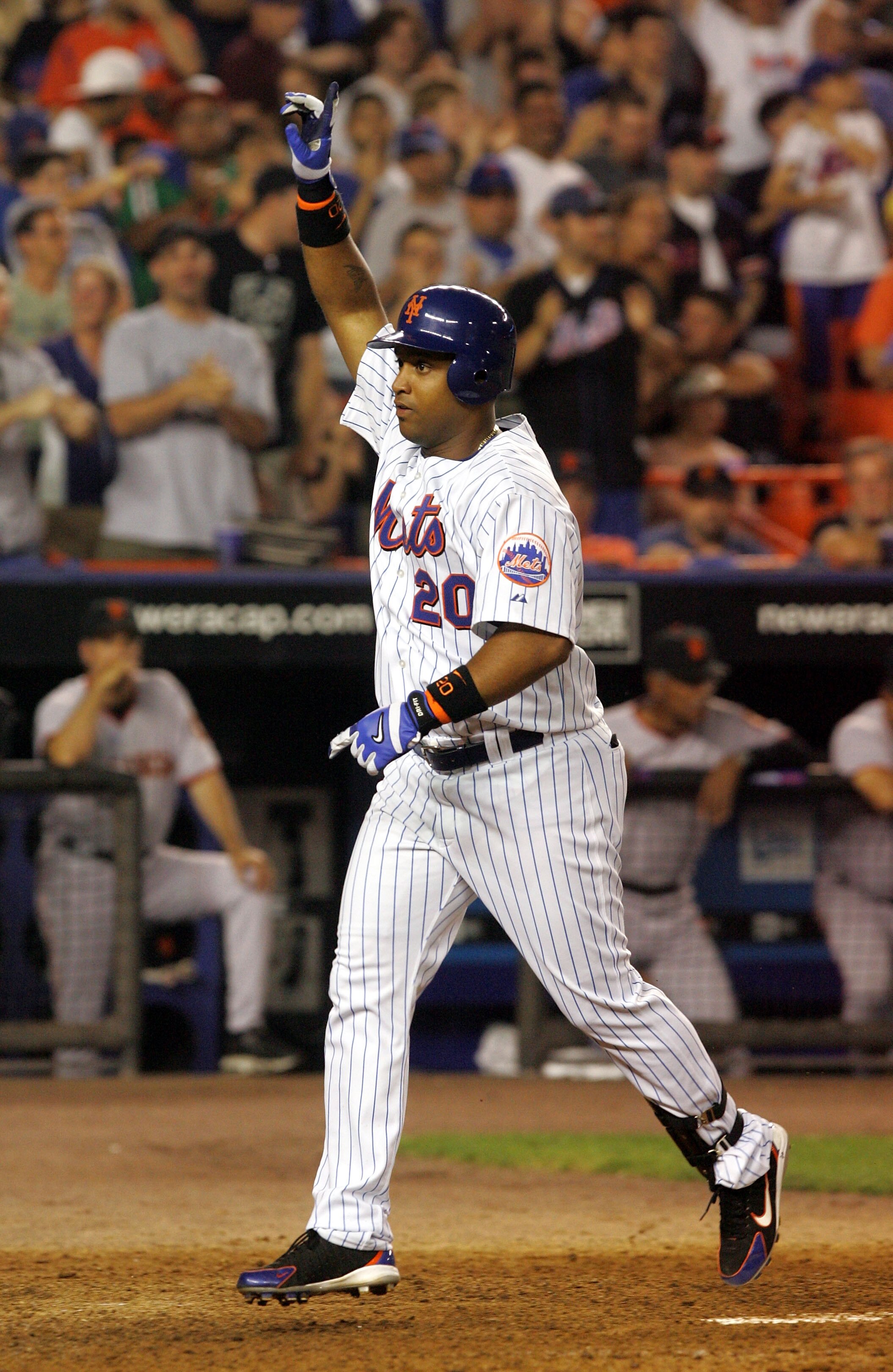 FLUSHING, NY - JUNE 5:  Victor Diaz #20 of the New York Mets heads for home plate after hitting his two-run home run in the fifth inning against the San Francisco Giants during the second game of their double header at Shea Stadium on June 5, 2005 in Flus