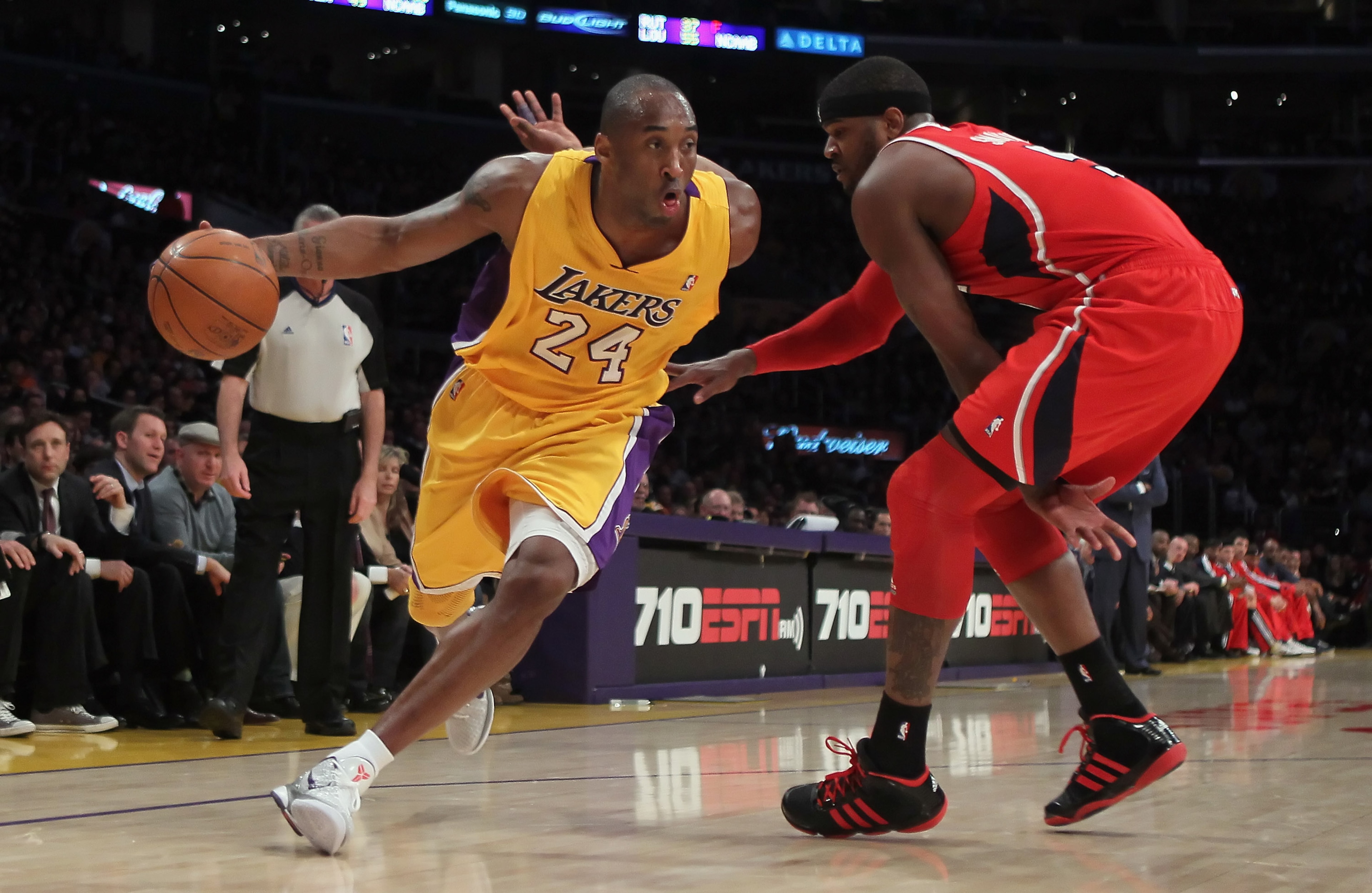 LOS ANGELES, CA - FEBRUARY 22:  Kobe Bryant #24 of the Los Angeles Lakers drives around Josh Smith #5 of the Atlanta Hawks in the first half at Staples Center on February 22, 2011 in Los Angeles, California. NOTE TO USER: User expressly acknowledges and a