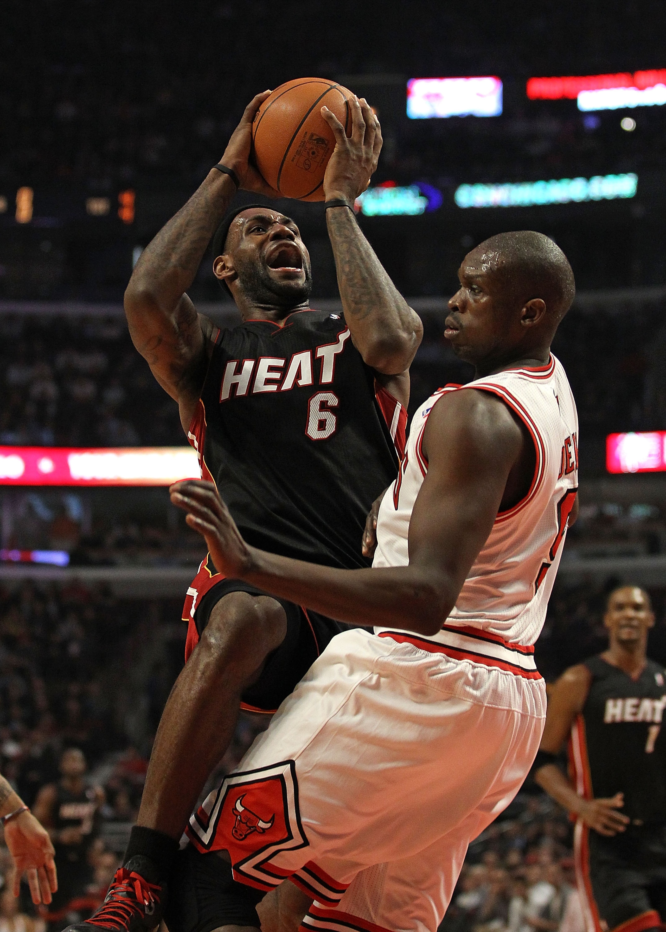 CHICAGO, IL - FEBRUARY 24: LeBron James #6 of the Miami Heat puts up a shot against Loul Deng #9 of the Chicago Bulls at the United Center on February 24, 2011 in Chicago, Illinois. NOTE TO USER: User expressly acknowledges and agrees that, by downloading