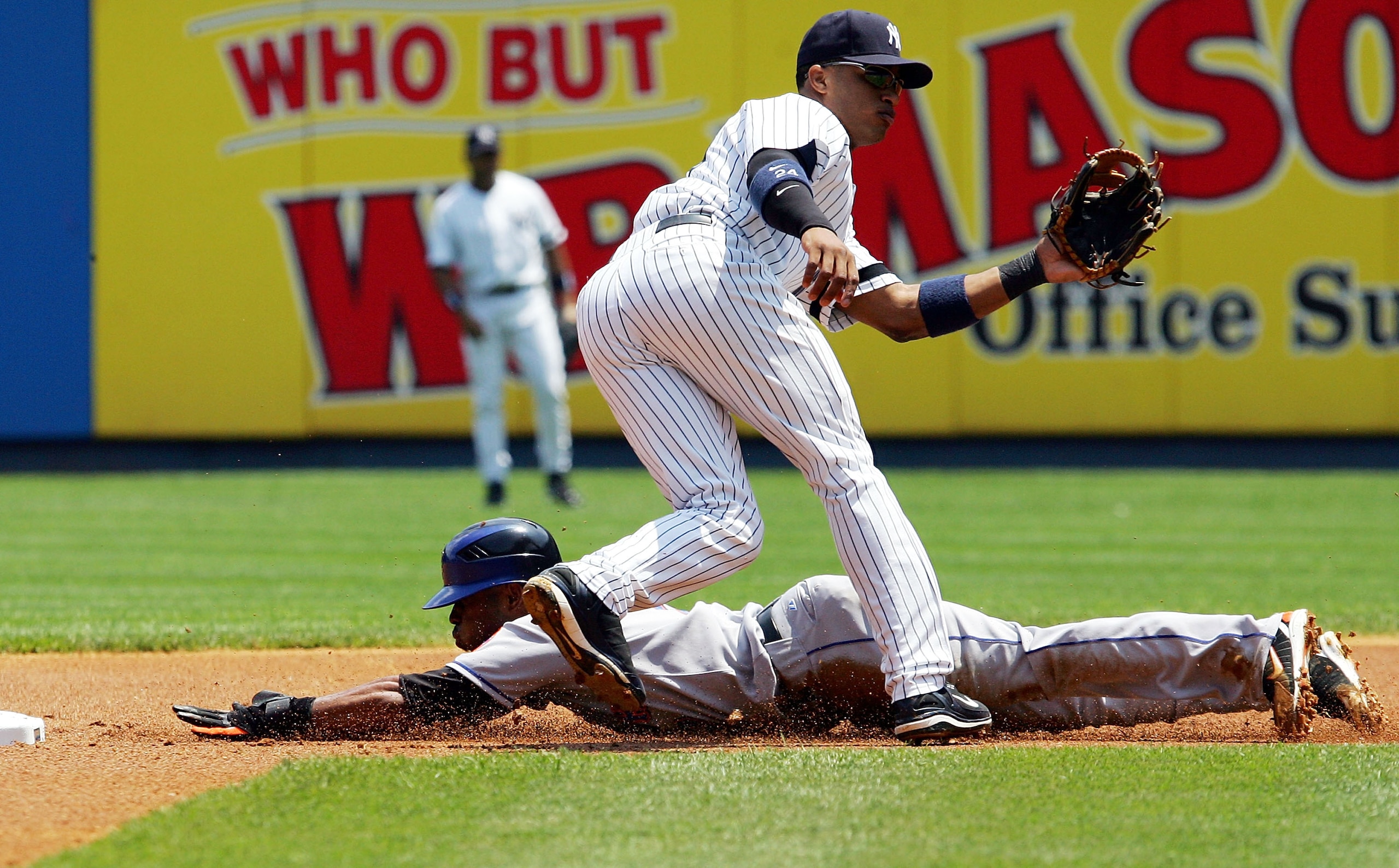 NEW YORK - JUNE 16:  Jose Reyes #7 of the New York Mets steals second base in the third inning against Robinson Cano #24 of the New York Yankees on June 16, 2007 at Yankee Stadium in the Bronx borough of New York City.  (Photo by Jim McIsaac/Getty Images)