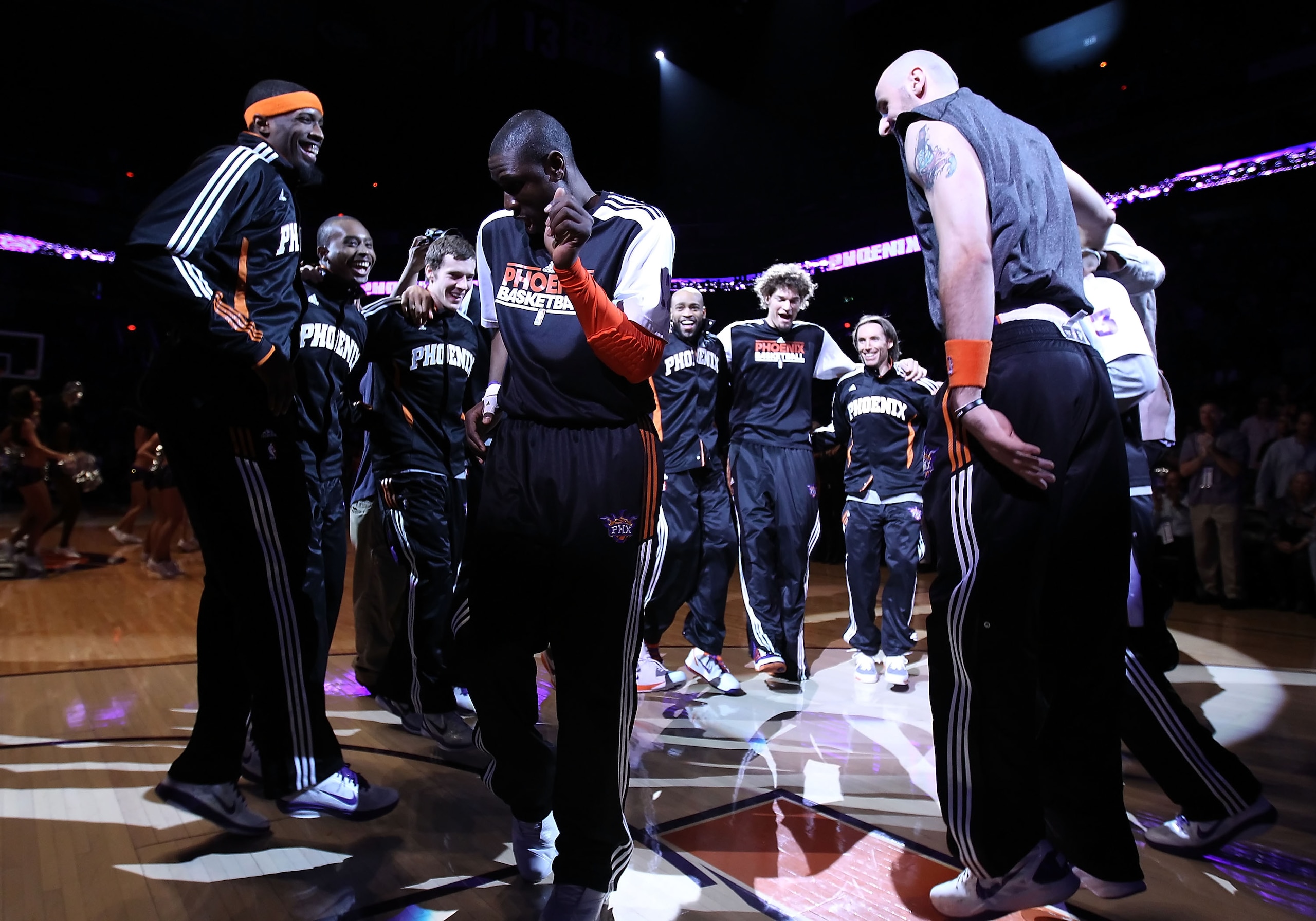 PHOENIX, AZ - FEBRUARY 17: Mickael Pietrus #12 of the Phoenix Suns moonwalks into the huddle with teammates before the NBA game against the Dallas Mavericks at US Airways Center on February 17, 2011 in Phoenix, Arizona. The Mavericks defeated the Suns PHOENIX, AZ - FEBRUARY 17: Mickael Pietrus #12 of the Phoenix Suns moonwalks into the huddle with teammates before the NBA game against the Dallas Mavericks at US Airways Center on February 17, 2011 in Phoenix, Arizona. The Mavericks defeated the Suns