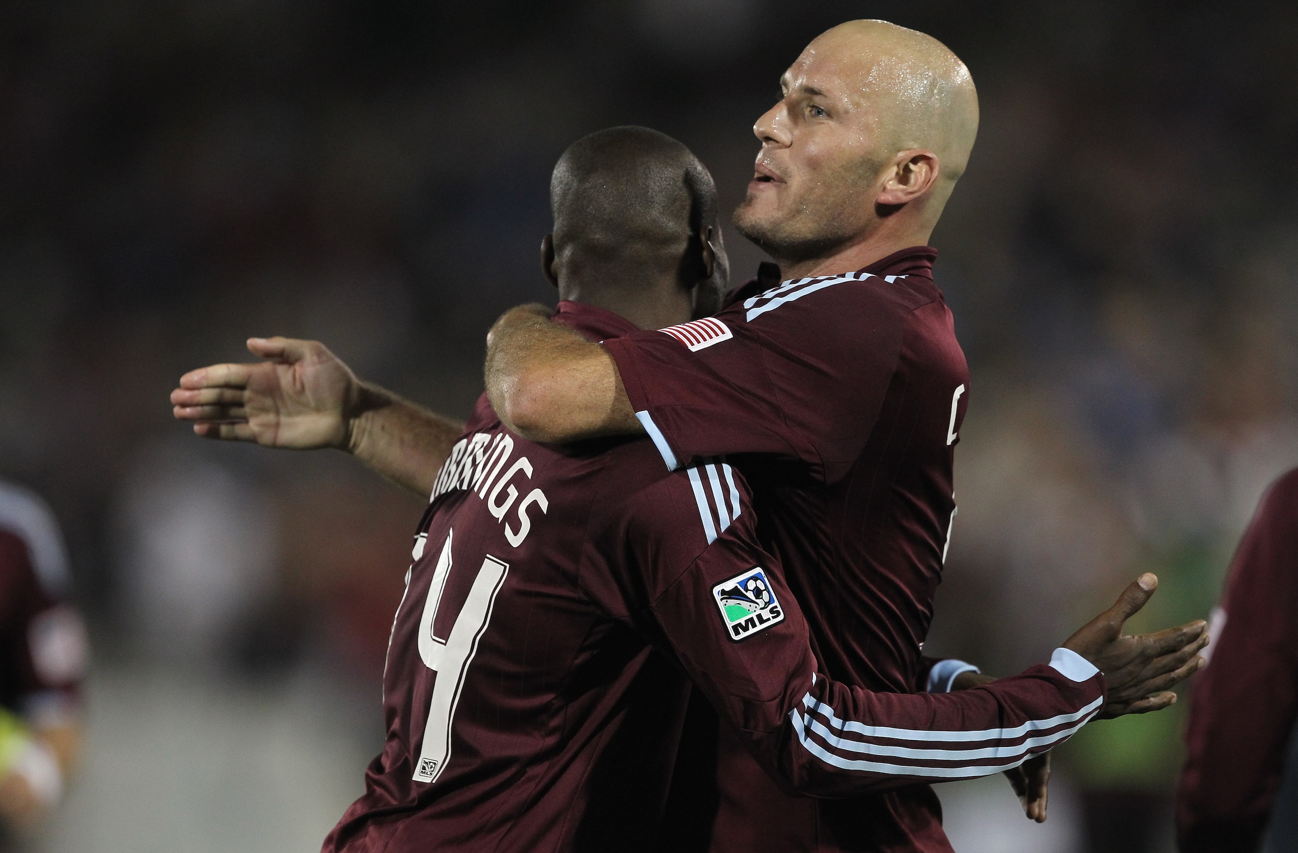 COMMERCE CITY, CO - SEPTEMBER 18:  Conor Casey #9 (R) of the Colorado Rapids is celebrates his goal with Omar Cummings #14 (L) in the 35th minute against the New England Revolution to give the Rapids a 2-0 lead at Dick's Sporting Goods Park on September 1