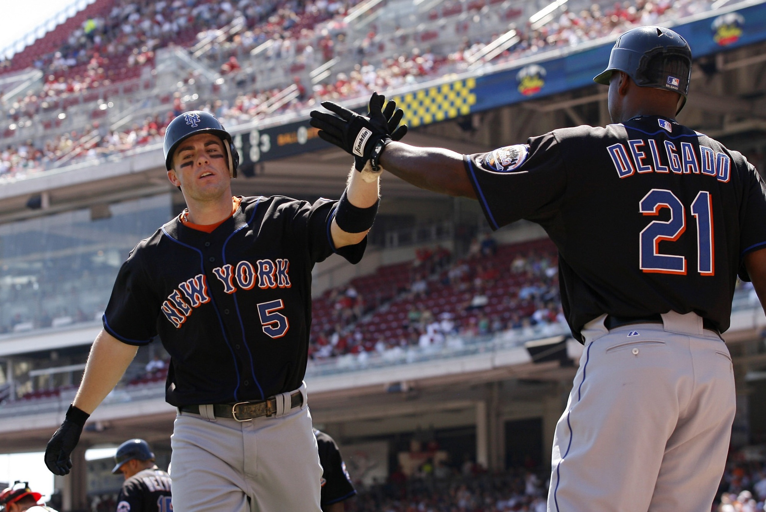 CINCINNATI - SEPTEMBER 3: Third baseman David Wright #5 high fives Carlos Delgado #21 after hitting a solo home run against the Cincinnati Reds on September 3, 2007 at Great American Ball Park in Cincinnati, Ohio. (Photo by Thomas E. Witte/Getty Images) CINCINNATI - SEPTEMBER 3: Third baseman David Wright #5 high fives Carlos Delgado #21 after hitting a solo home run against the Cincinnati Reds on September 3, 2007 at Great American Ball Park in Cincinnati, Ohio. (Photo by Thomas E. Witte/Getty Images)