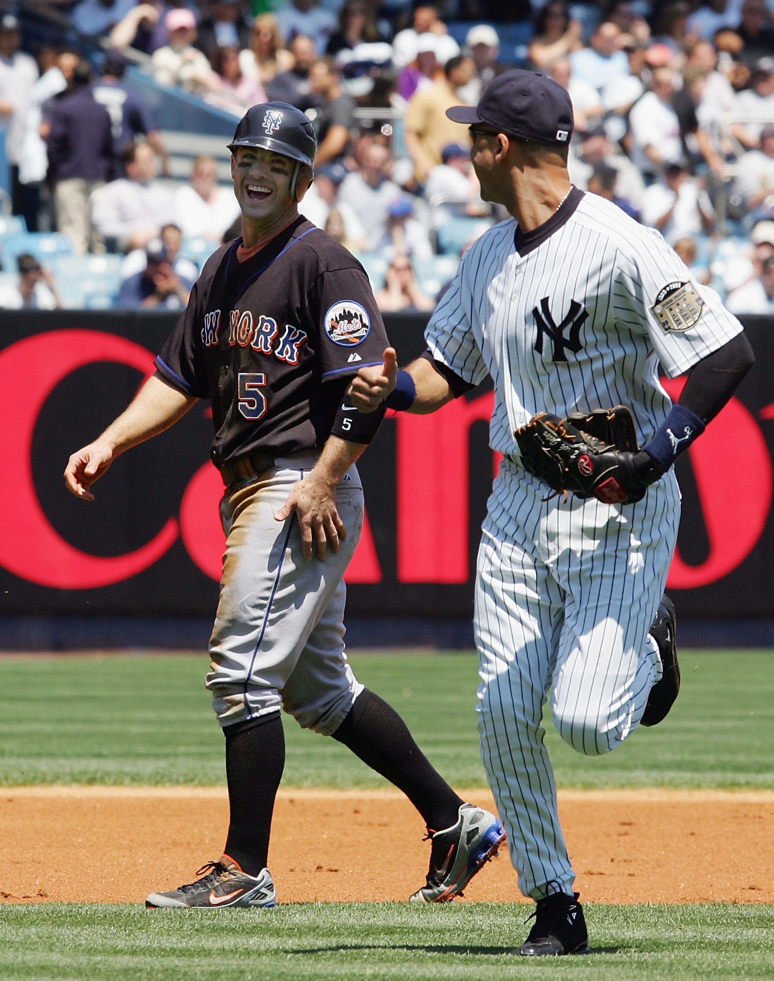 NEW YORK - MAY 17: David Wright #5 of the New York Mets and Derek Jeter #2 of the New York Yankees run off the field on May 17, 2008 at Yankee Stadium in the Bronx borough of New York City. (Photo by Jim McIsaac/Getty Images)
