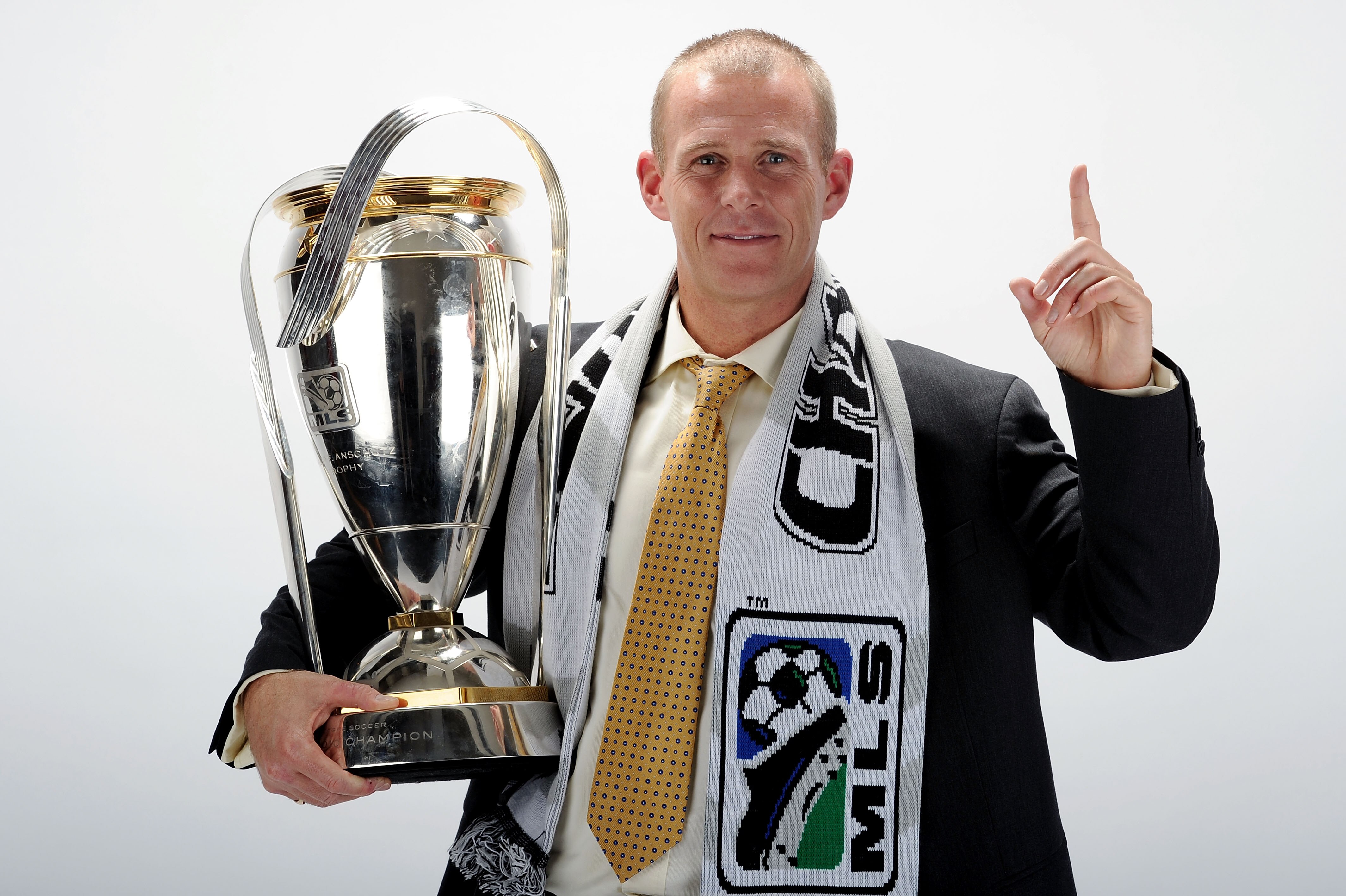 TORONTO, ON - NOVEMBER 21:  Gary Smith, Head Coach of the Colorado Rapids poses with the Philip F. Anschutz MLS Cup trophy following the MLS Cup final at BMO Field on November 21, 2010 in Toronto, Canada.  (Photo by Harry How/Getty Images)