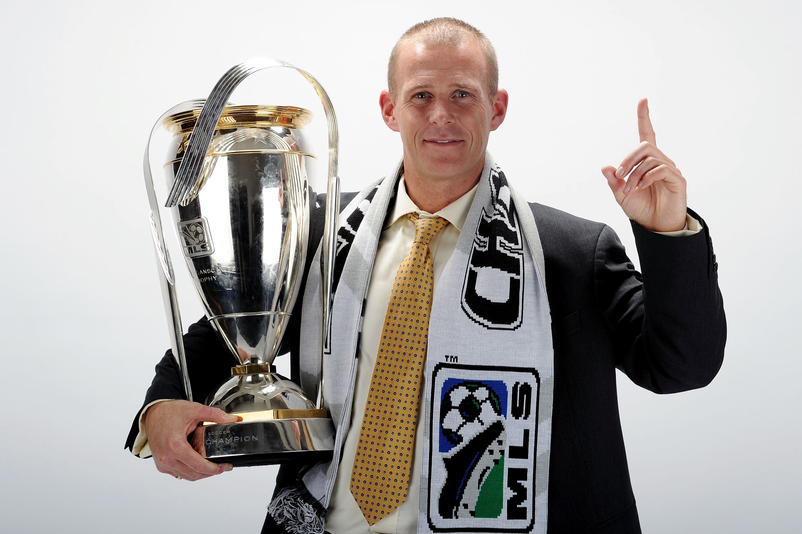 TORONTO, ON - NOVEMBER 21:  Gary Smith, Head Coach of the Colorado Rapids poses with the Philip F. Anschutz MLS Cup trophy following the MLS Cup final at BMO Field on November 21, 2010 in Toronto, Canada.  (Photo by Harry How/Getty Images)